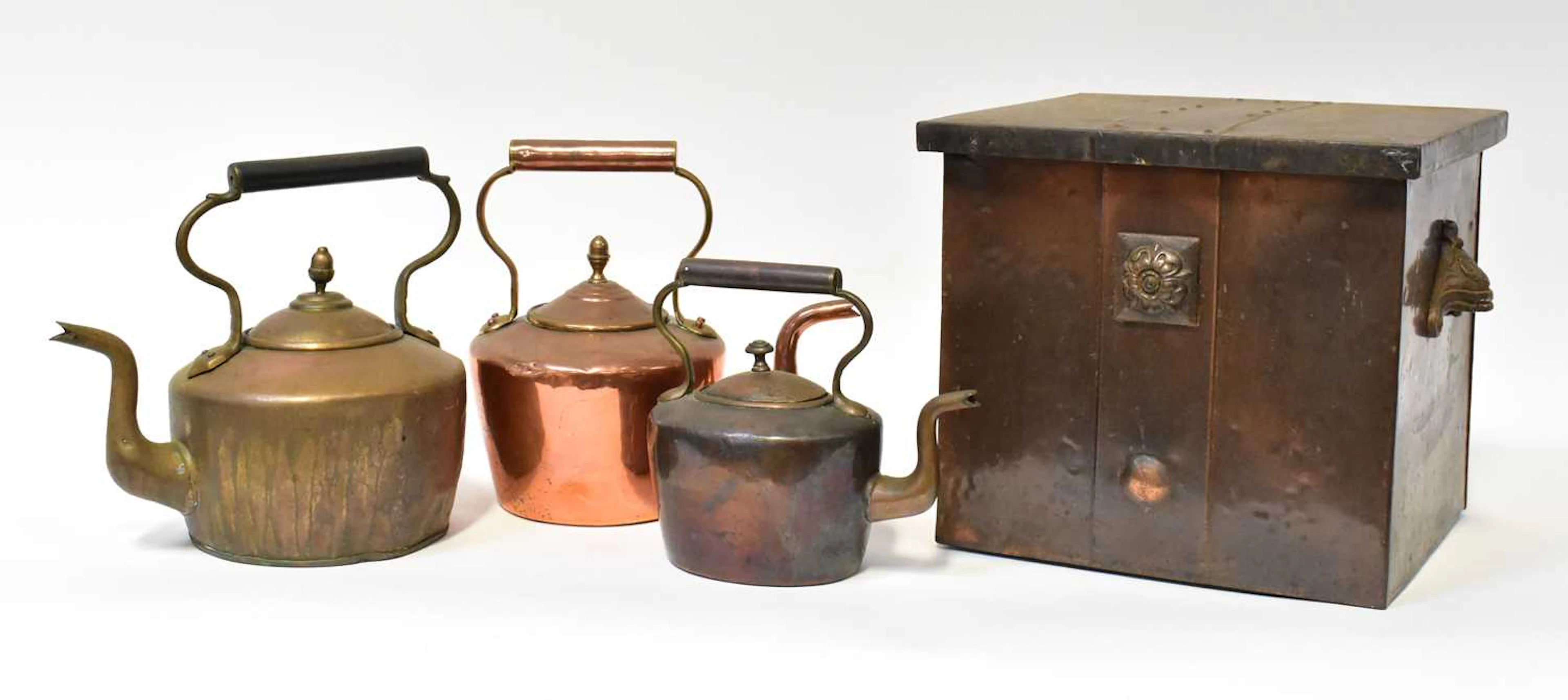 An Arts and Crafts copper coal scuttle of square form