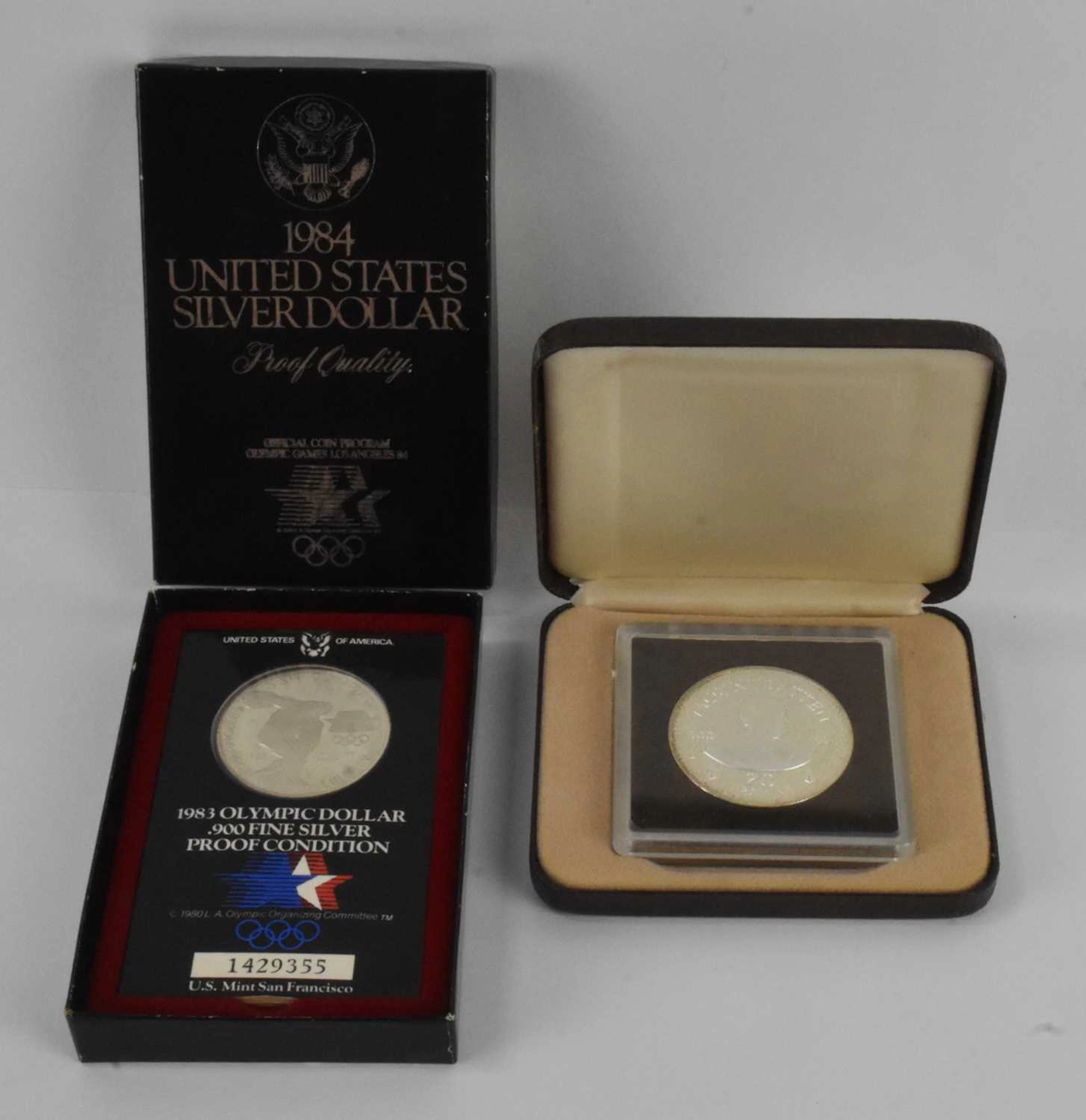 A cased encapsulated silver proof 1984 United States silver dollar