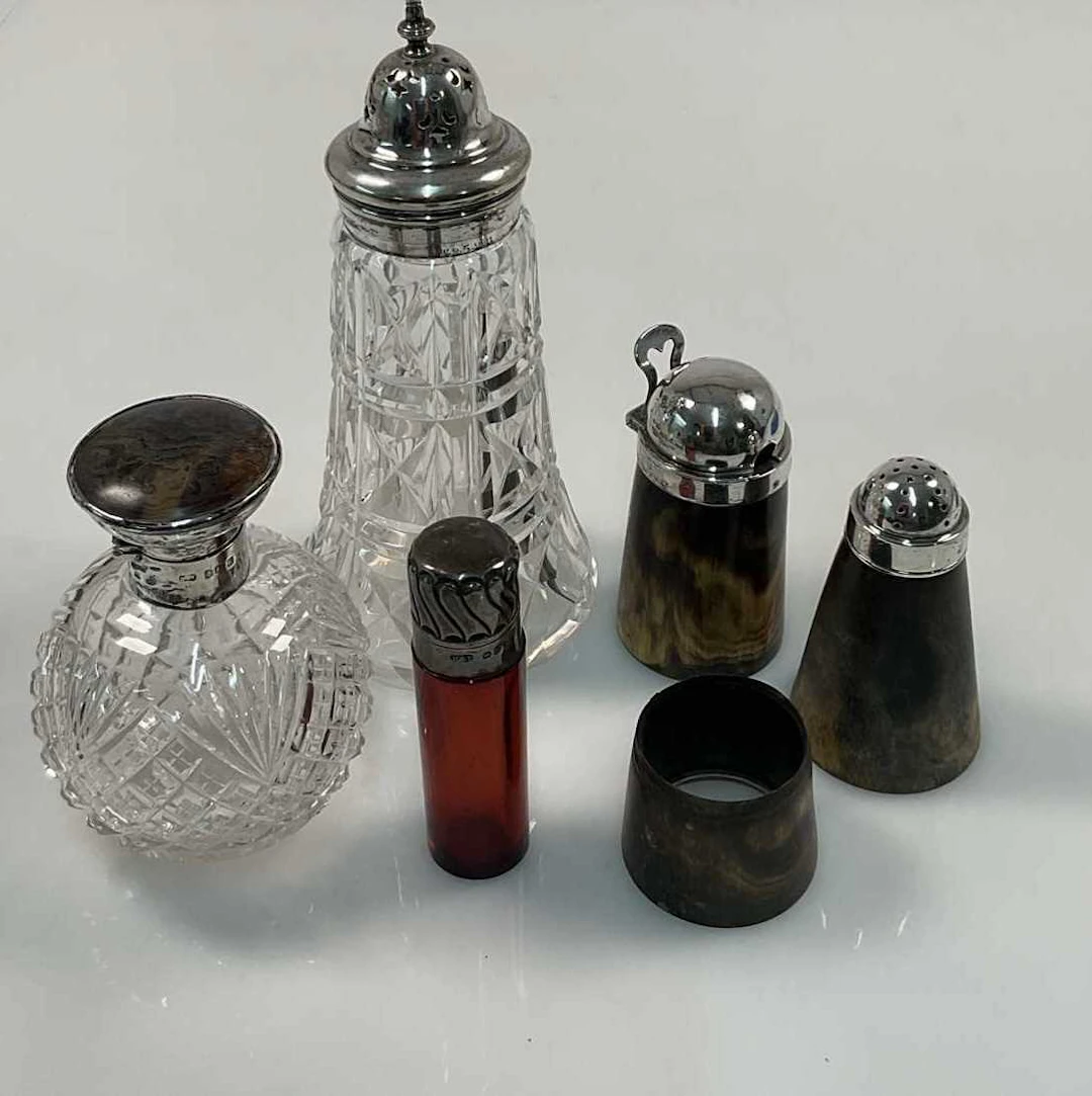 A quantity of hallmarked silver topped glass and horn ware