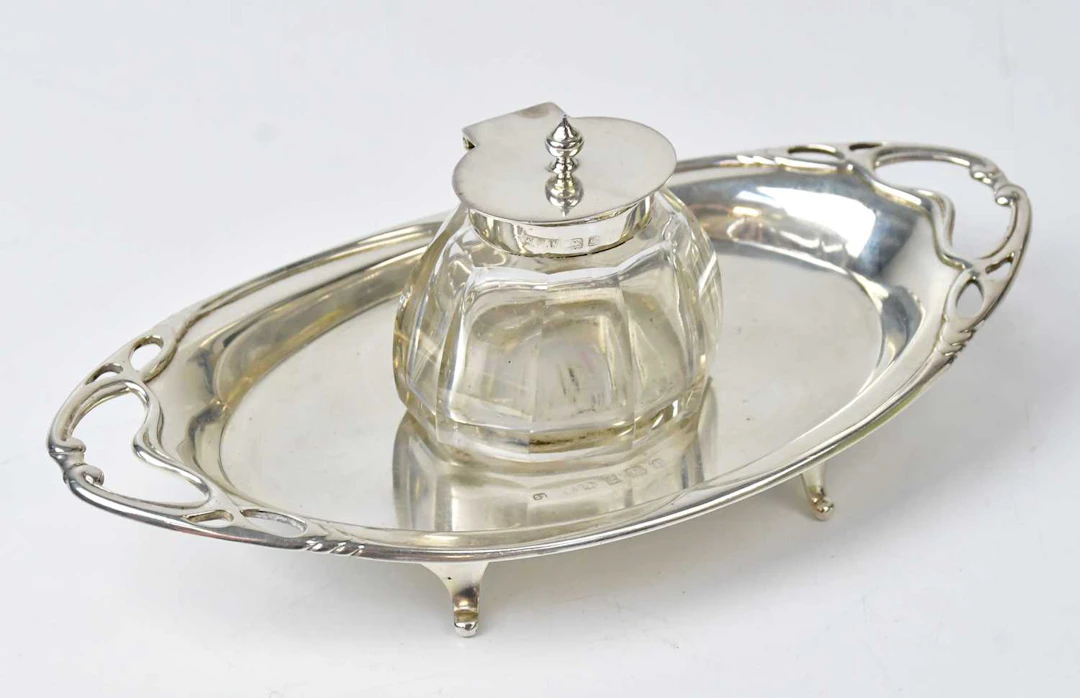 WILLIAM HARRISON WALTER; an Edward VII hallmarked silver inkwell and tray