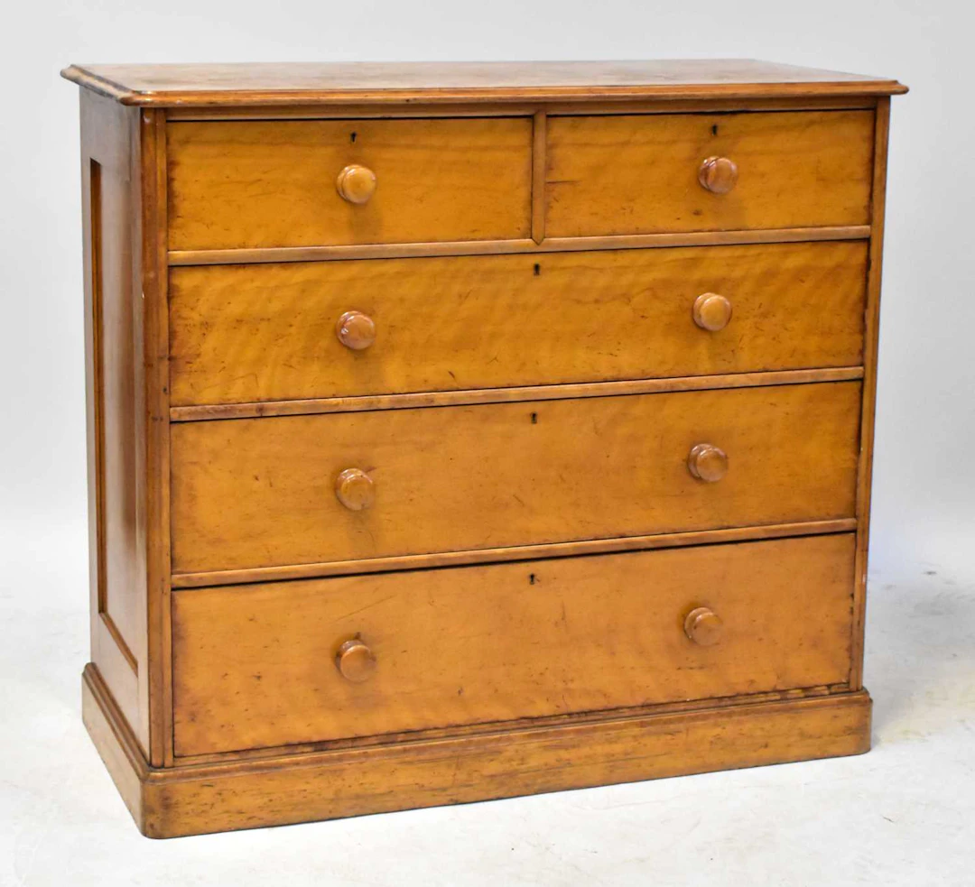 A Victorian satin walnut chest in the manner of Howard & Sons