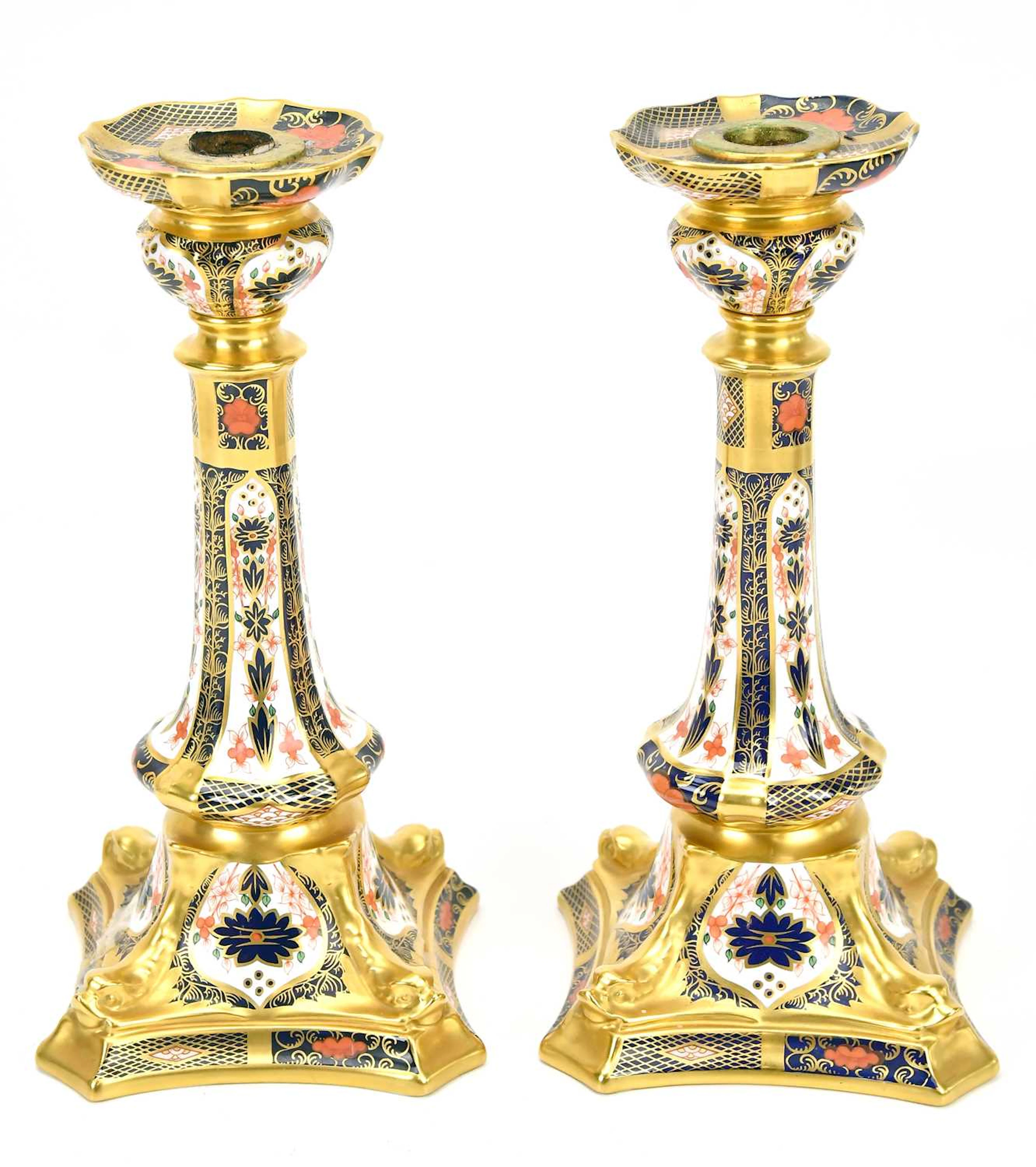 ROYAL CROWN DERBY; a pair of Imari candlesticks