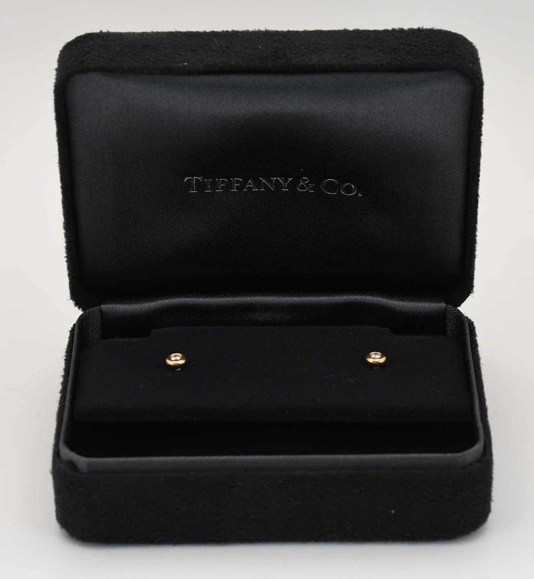 TIFFANY & CO; a pair of 18ct yellow gold diamond set ear studs