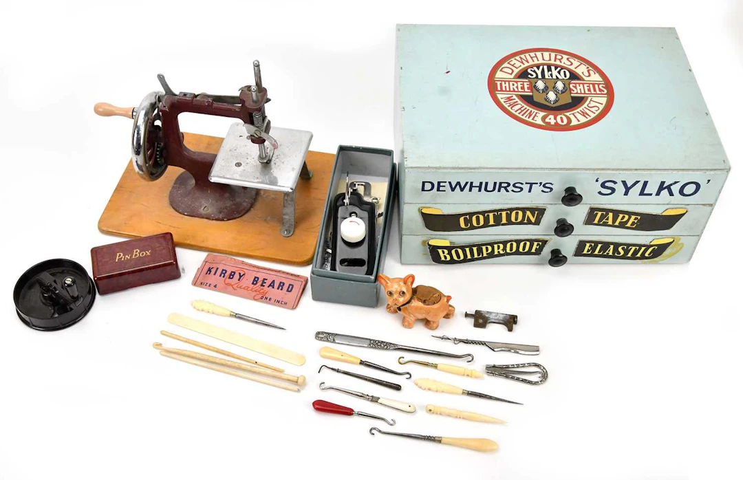 An advertising Dewhurst Silks three drawer cabinet