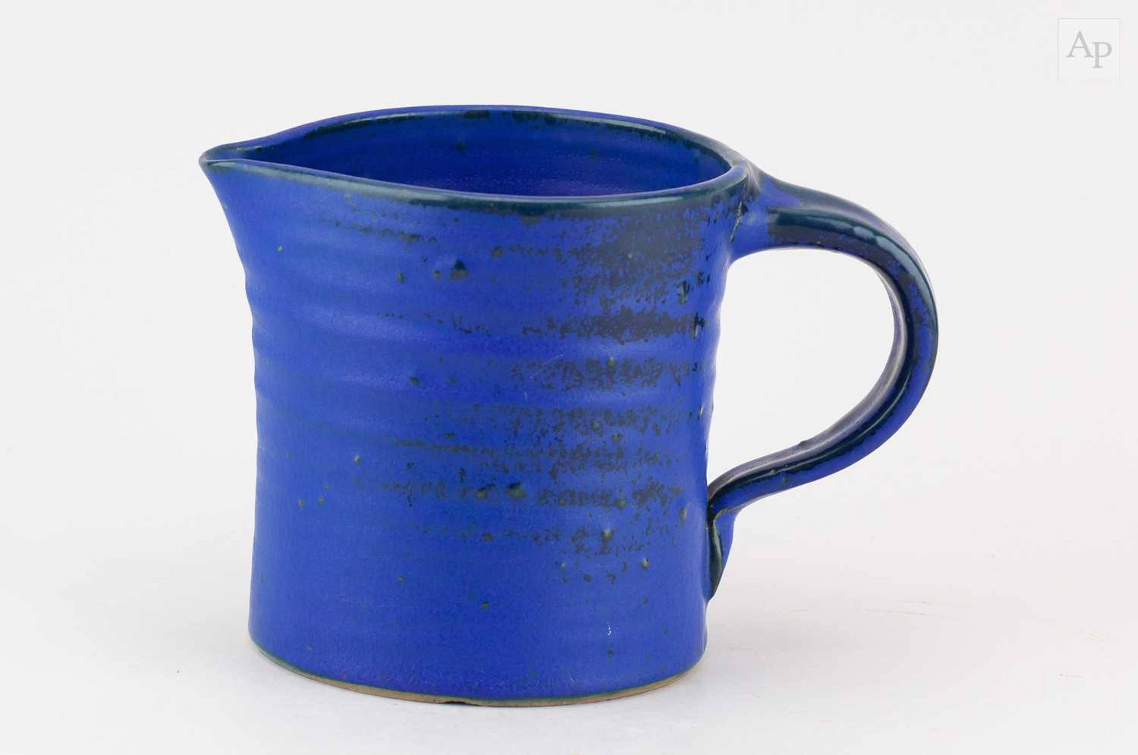 DAN ARBEID (1928-2010); a stoneware jug covered in metallic blue glaze