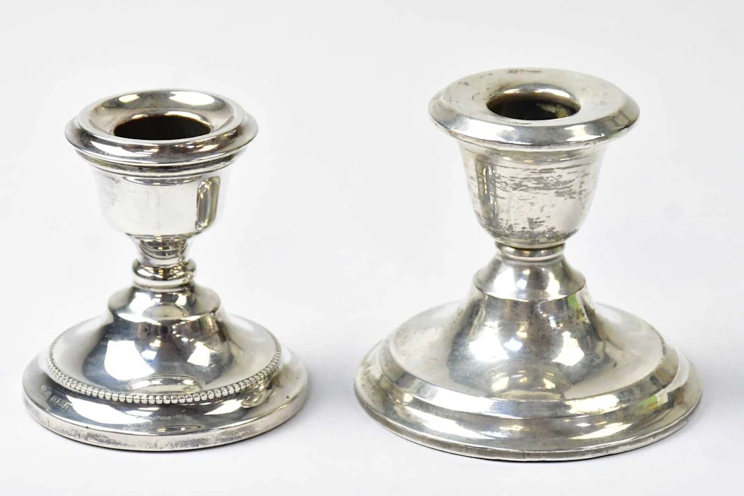 S BLACKENSEE & SON LTD; a Edward VII hallmarked silver squat candlestick
