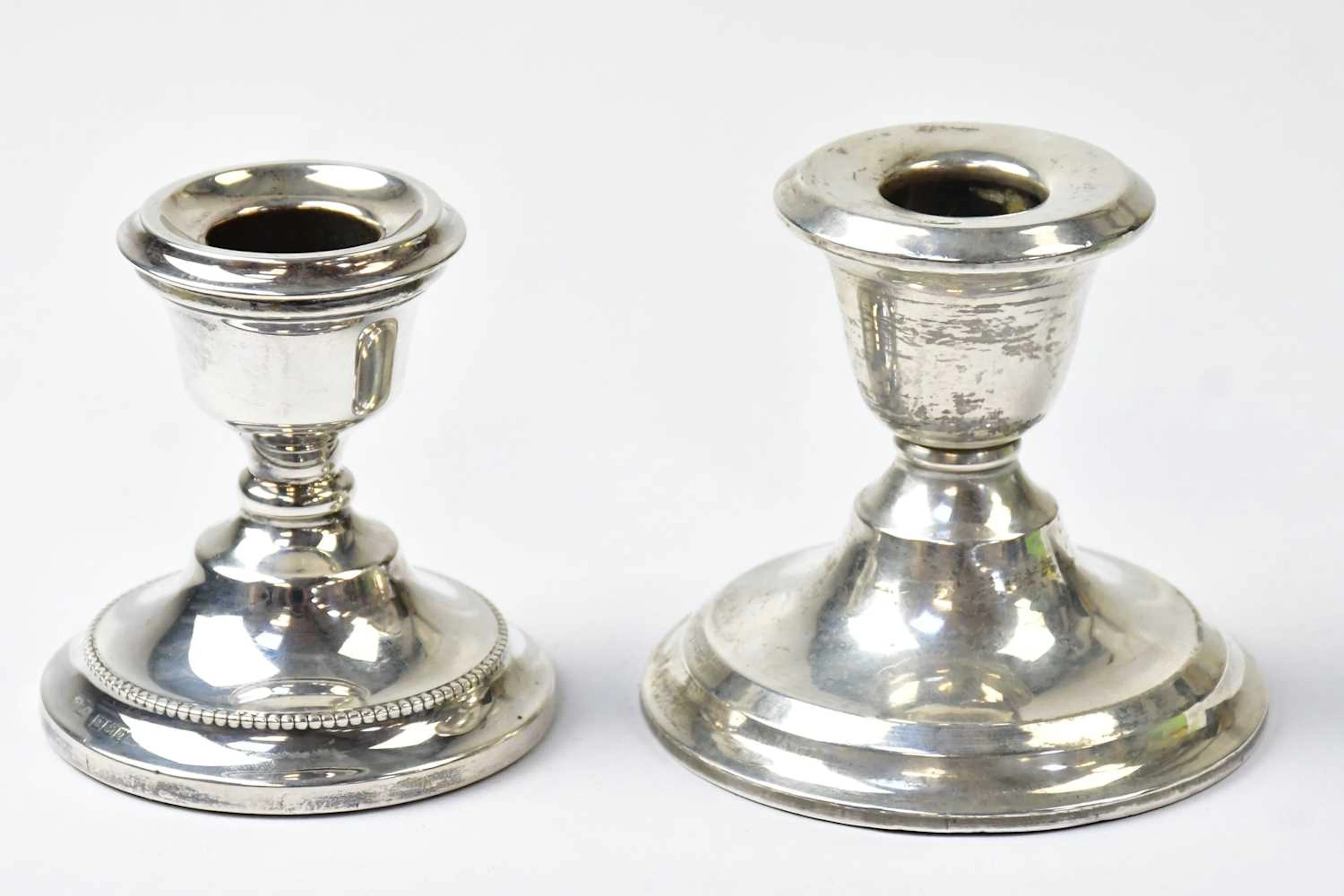 S BLACKENSEE & SON LTD; a Edward VII hallmarked silver squat candlestick