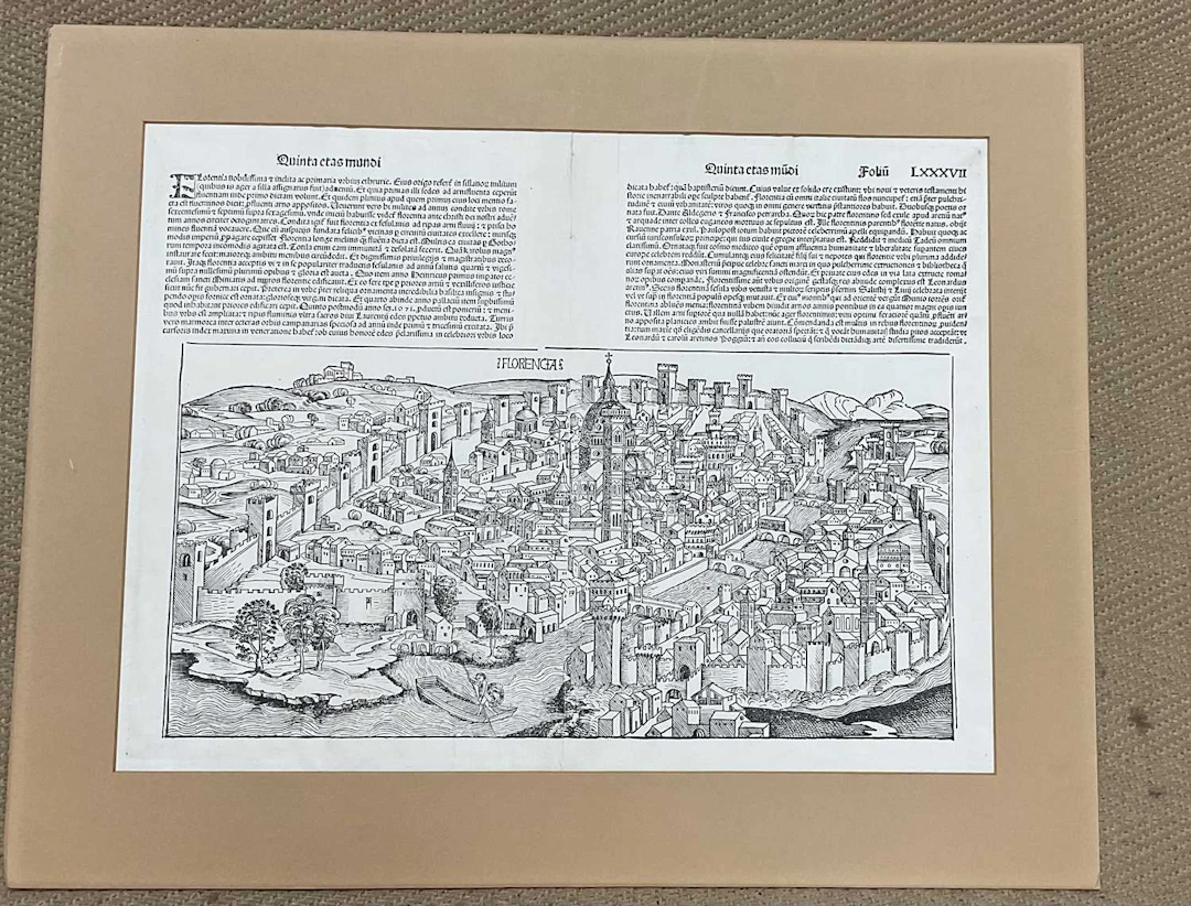 A double page-mounted black and white bird's eye view of Florence