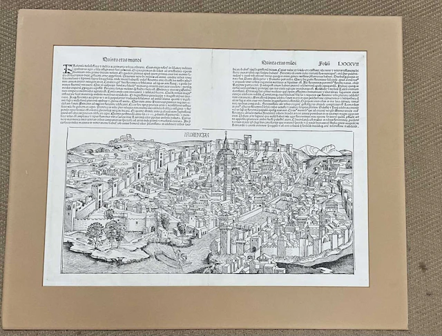 A double page mounted black and white bird's eye view of Florence