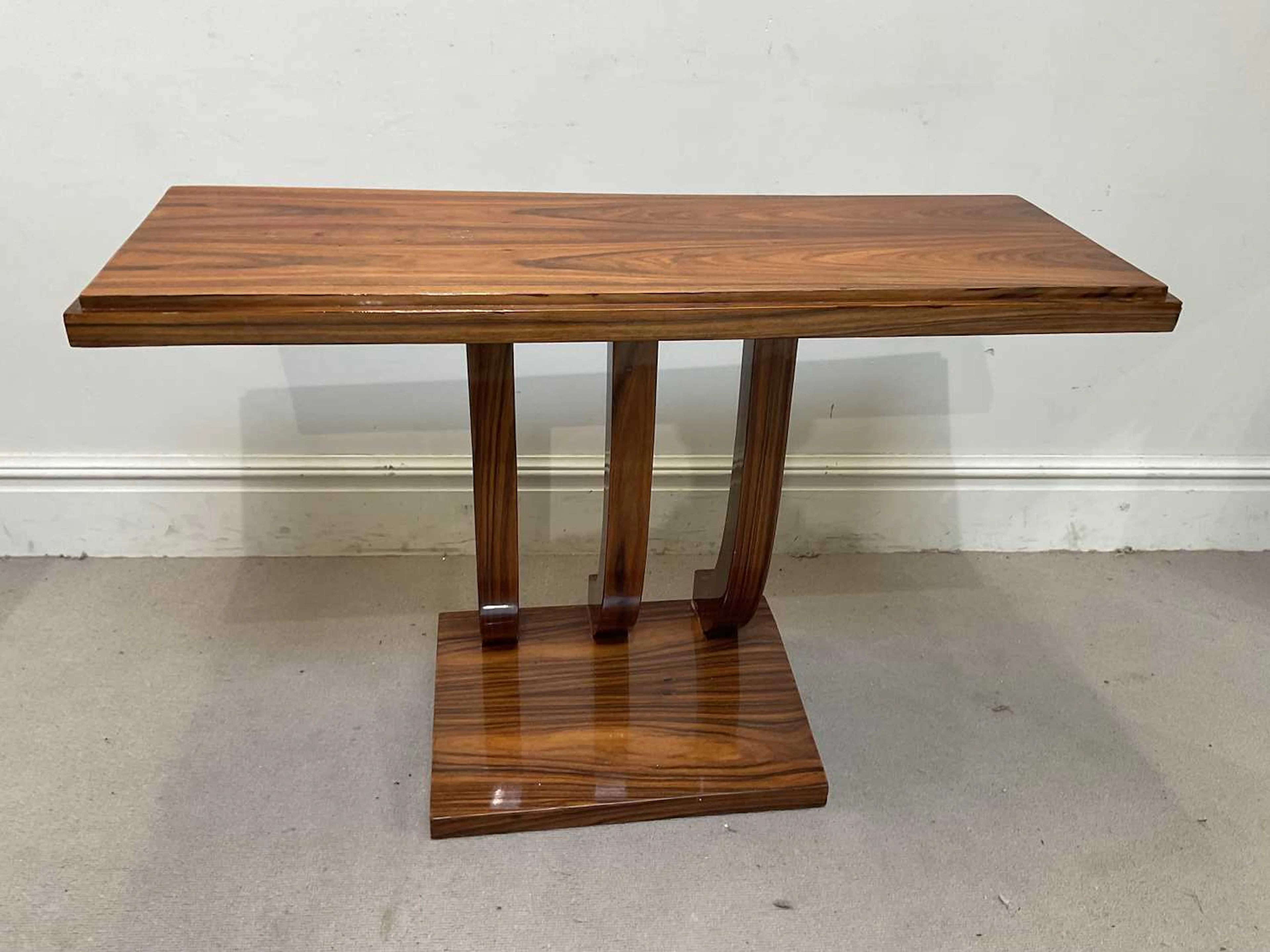 A modern rosewood veneered console table
