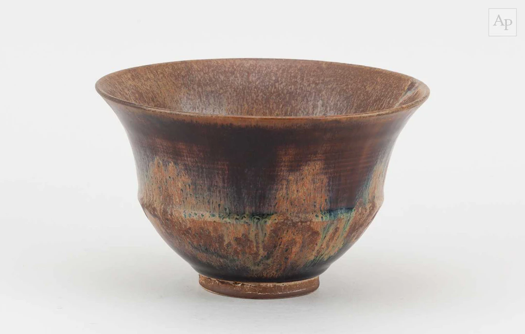 ABDO NAGI (1941-2001); a stoneware bowl covered in streaky beige