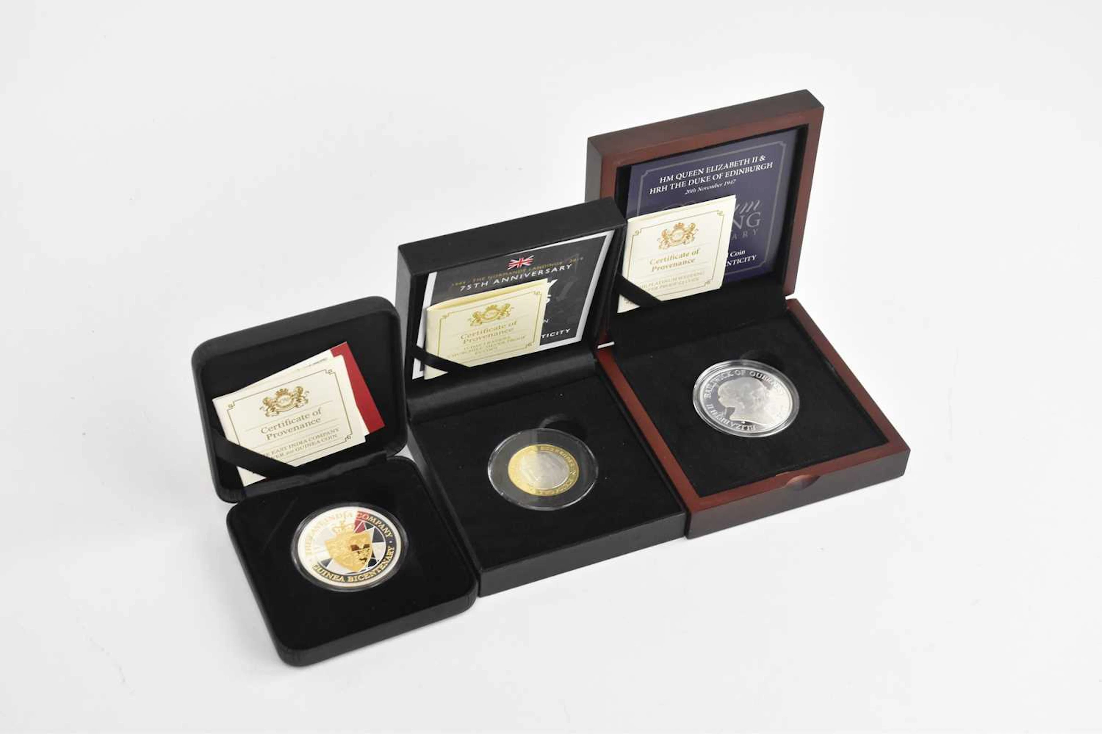 Three British proof coins comprising an Elizabeth II...