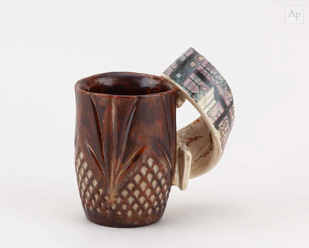 CAROL McNICOLL (1943-2025); an earthenware mug with eccentric handle