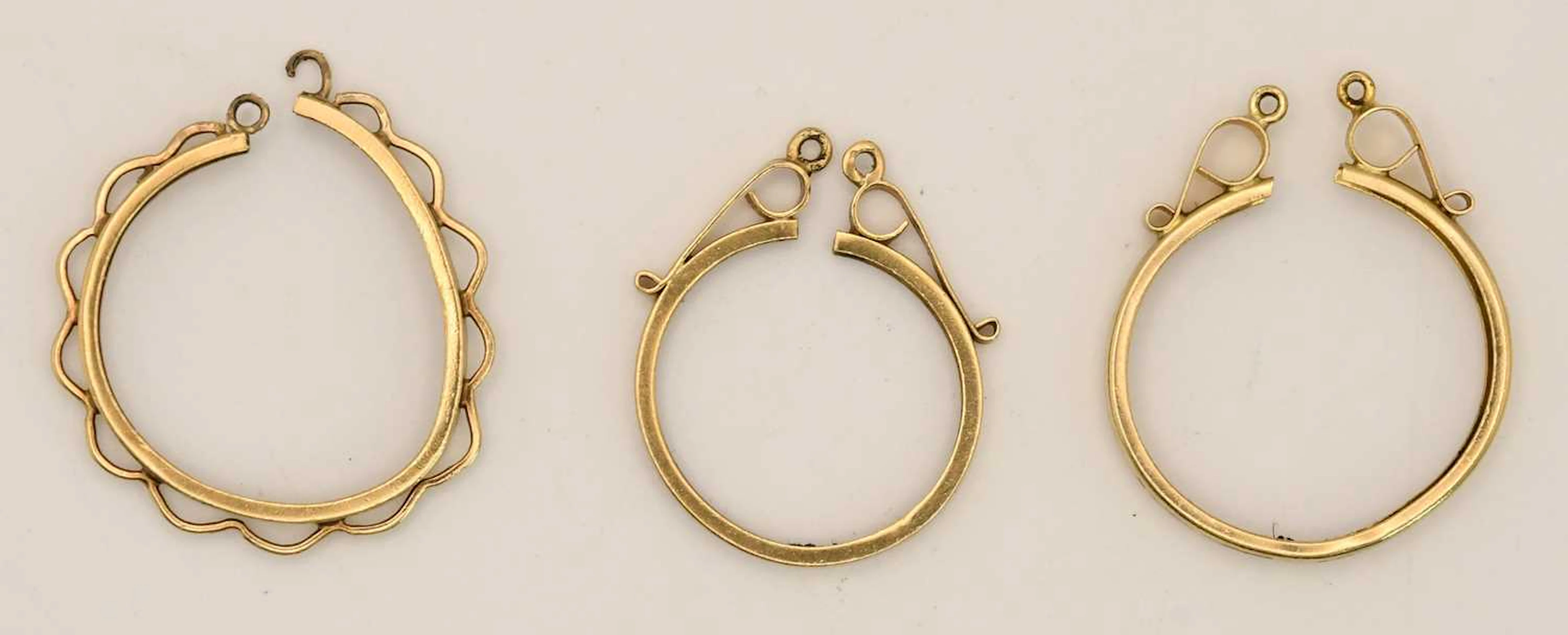 Three used 9ct yellow gold coin pendant mounts