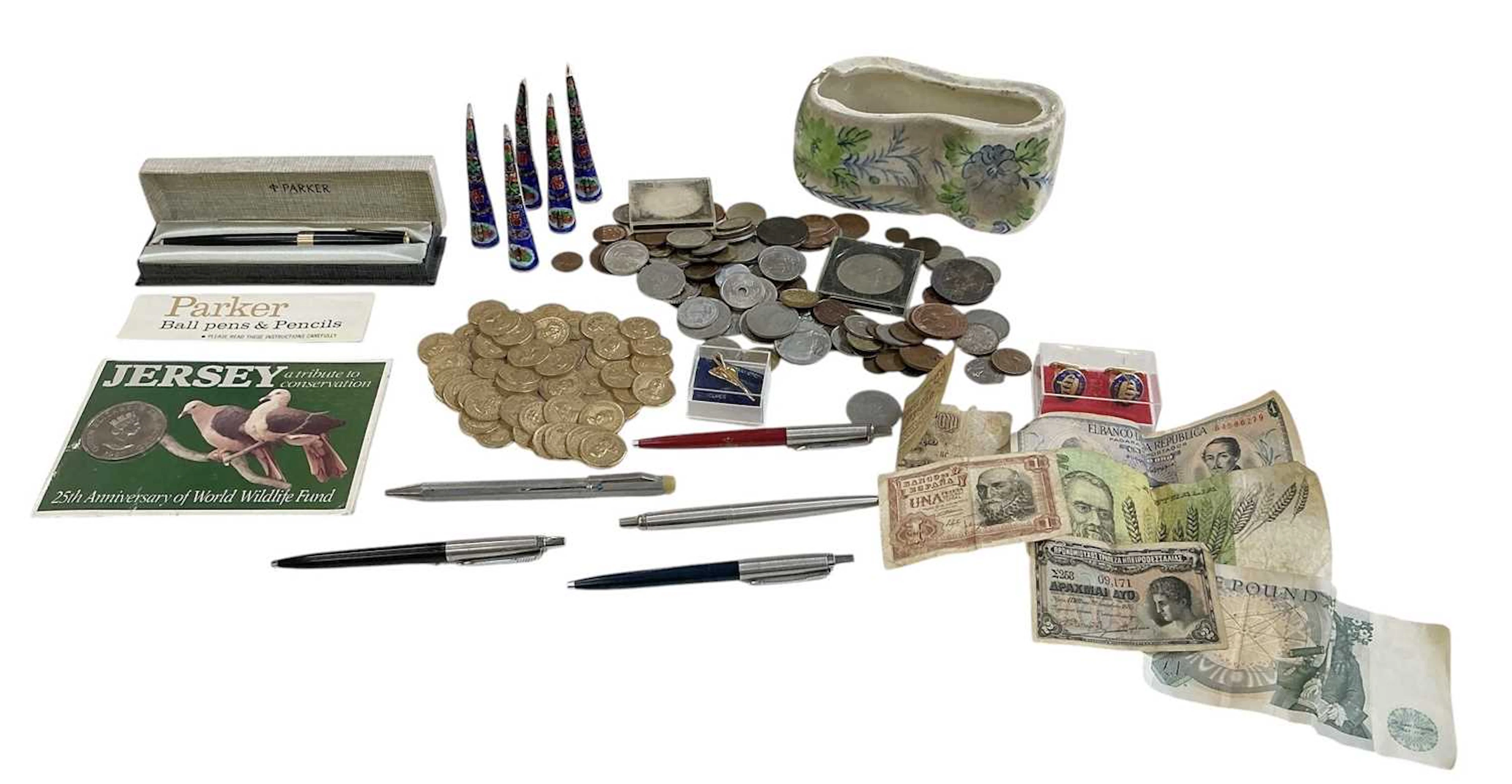 A quantity of assorted all world coins and banknotes