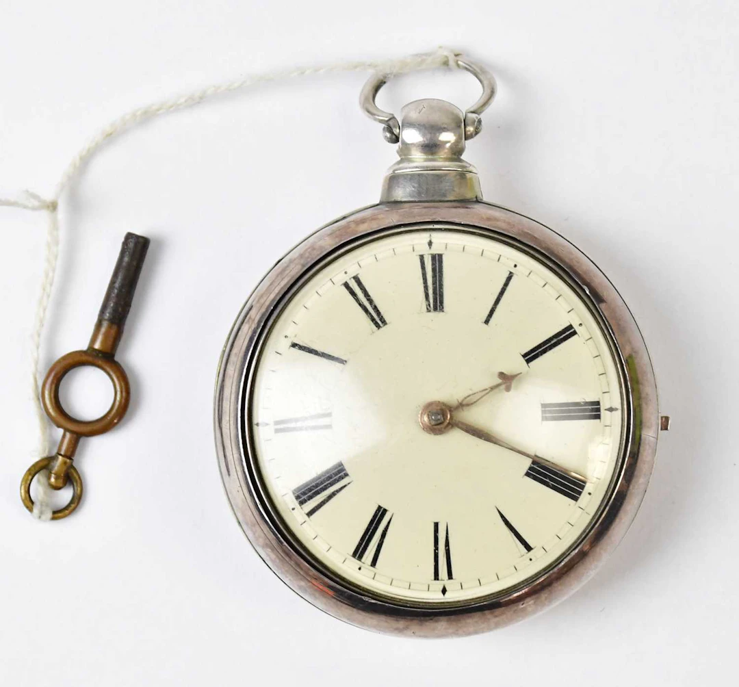 A Victorian hallmarked silver key wind pair cased open face pocket watch