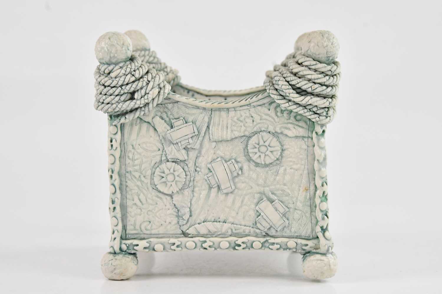 LARA SCOBIE; a small porcelain square box with applied detail