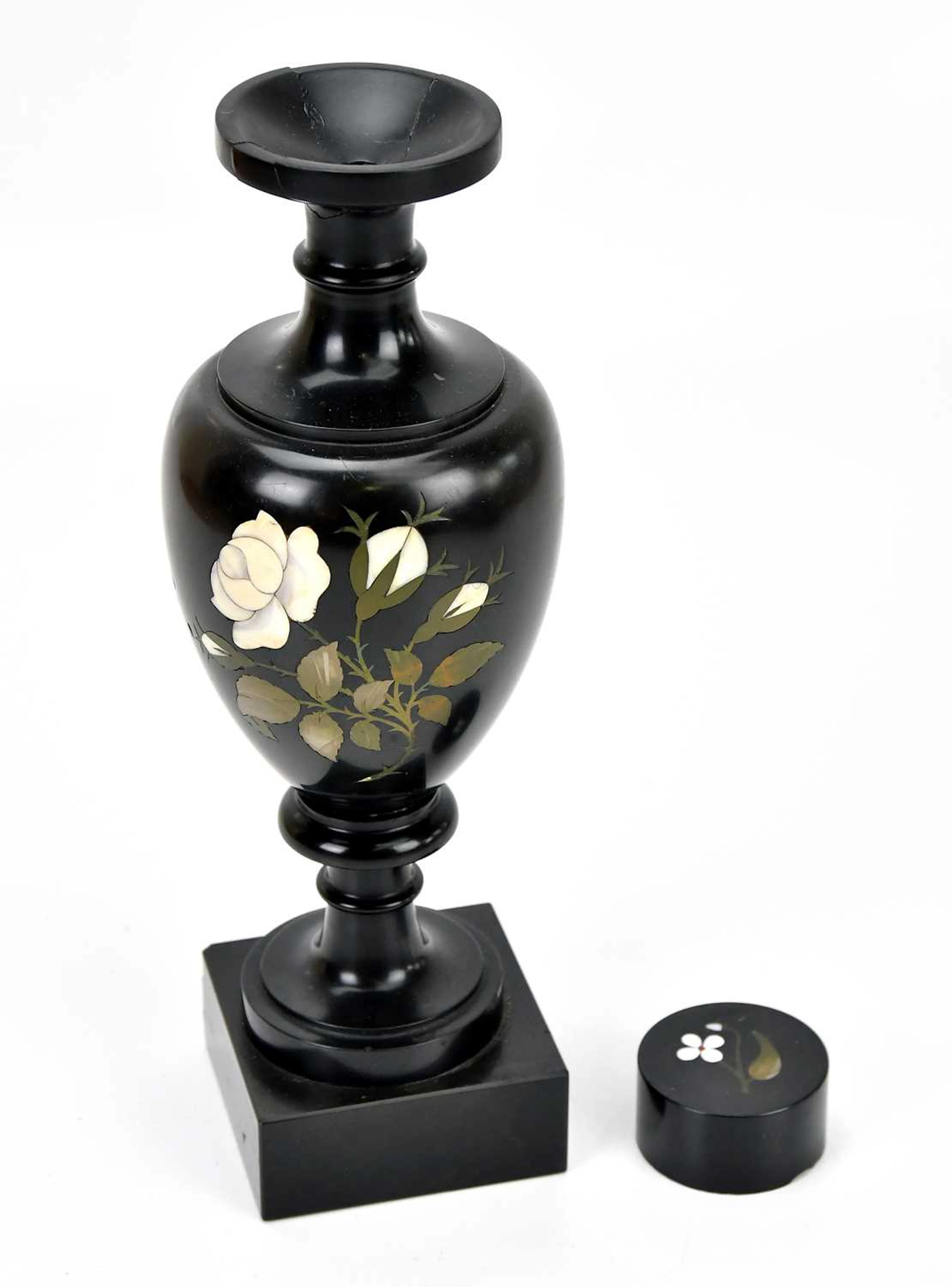 ASHFORD MARBLE; a vase with foliate detailing
