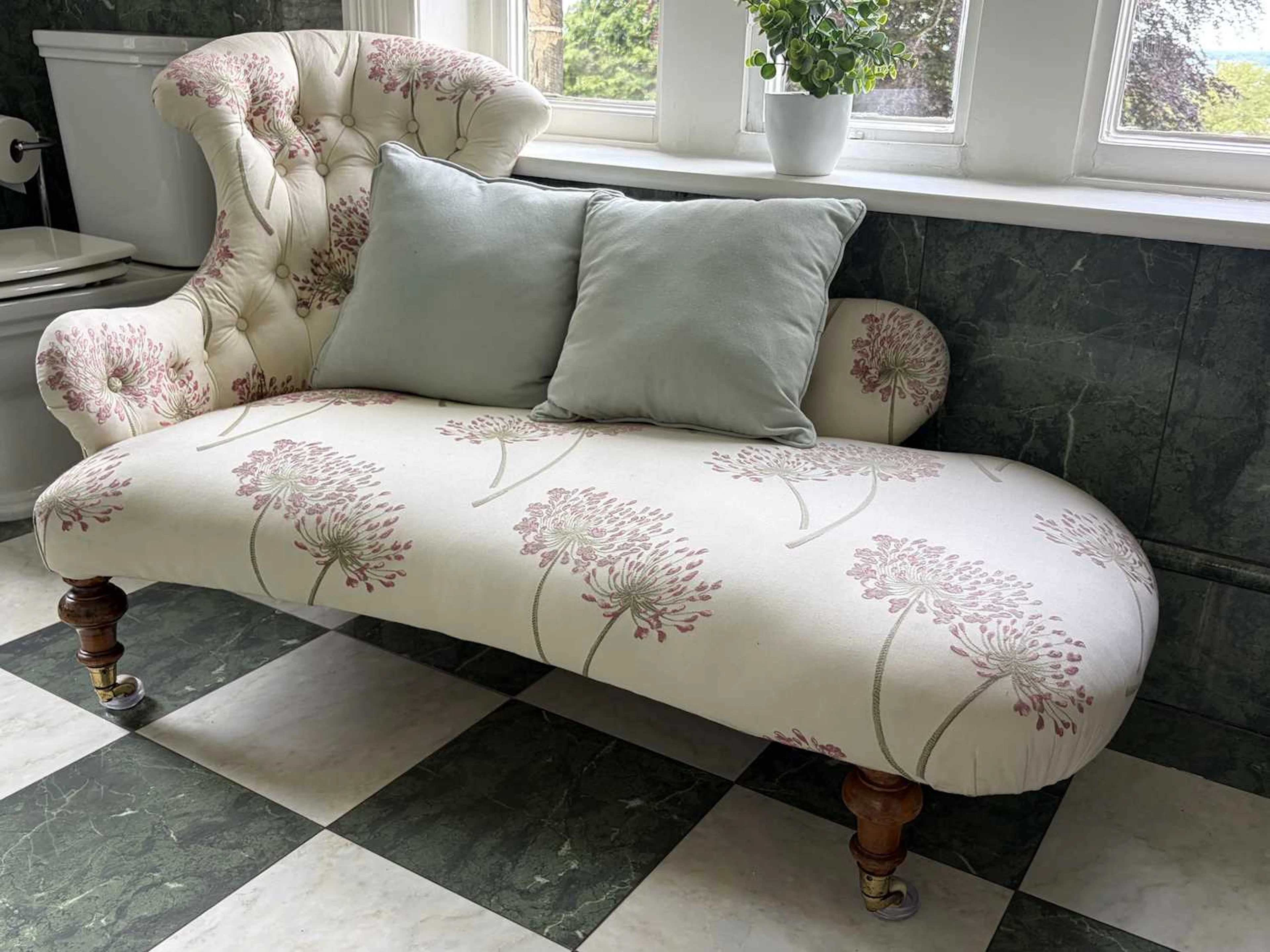 A Victorian mahogany chaise lounge