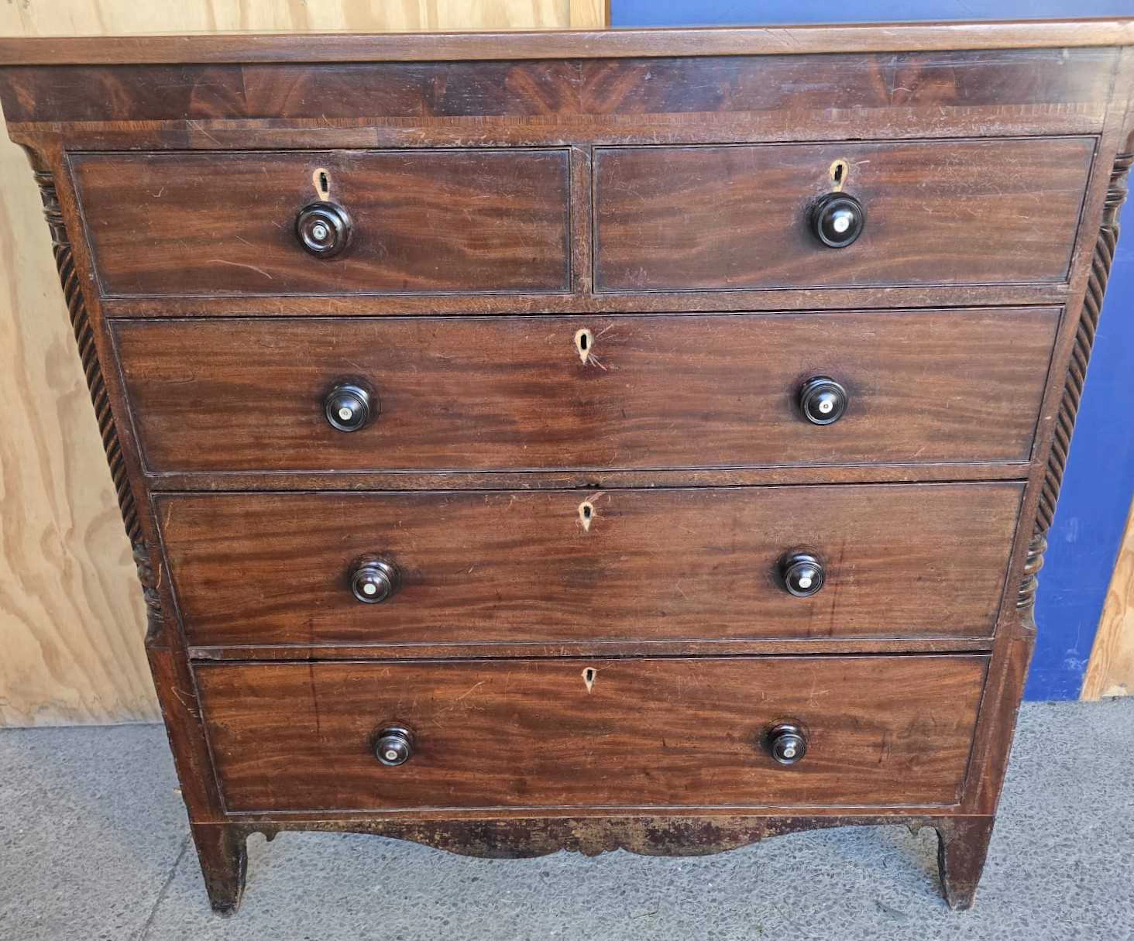 A 19th century mahogany chest of two small over four graduated long drawers