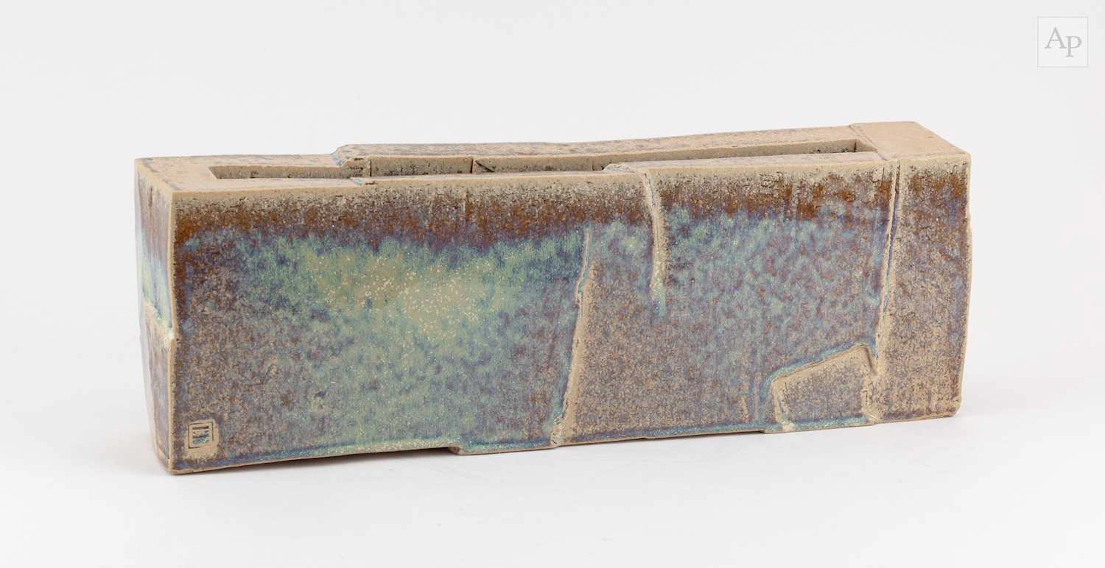 DAVID BINNS; a carved stoneware trough form partially...