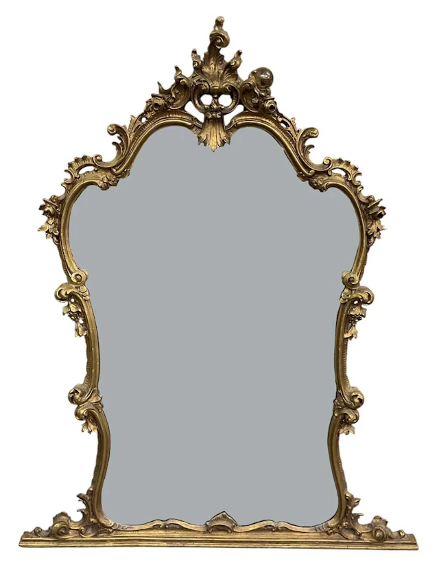 A modern elaborately gilt framed overmantel wall mirror