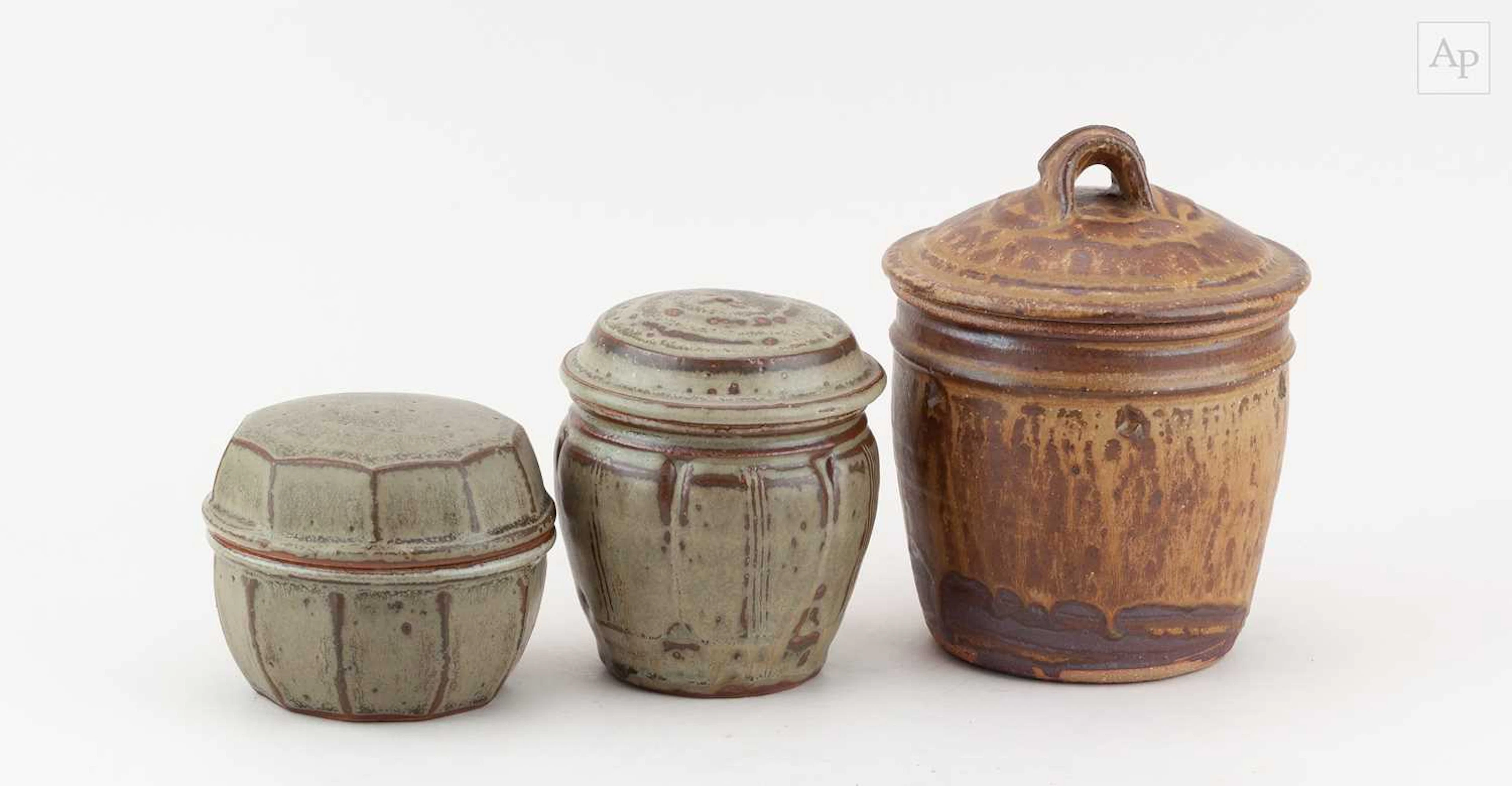 JIM MALONE (born 1946); a stoneware jar and cover covered...
