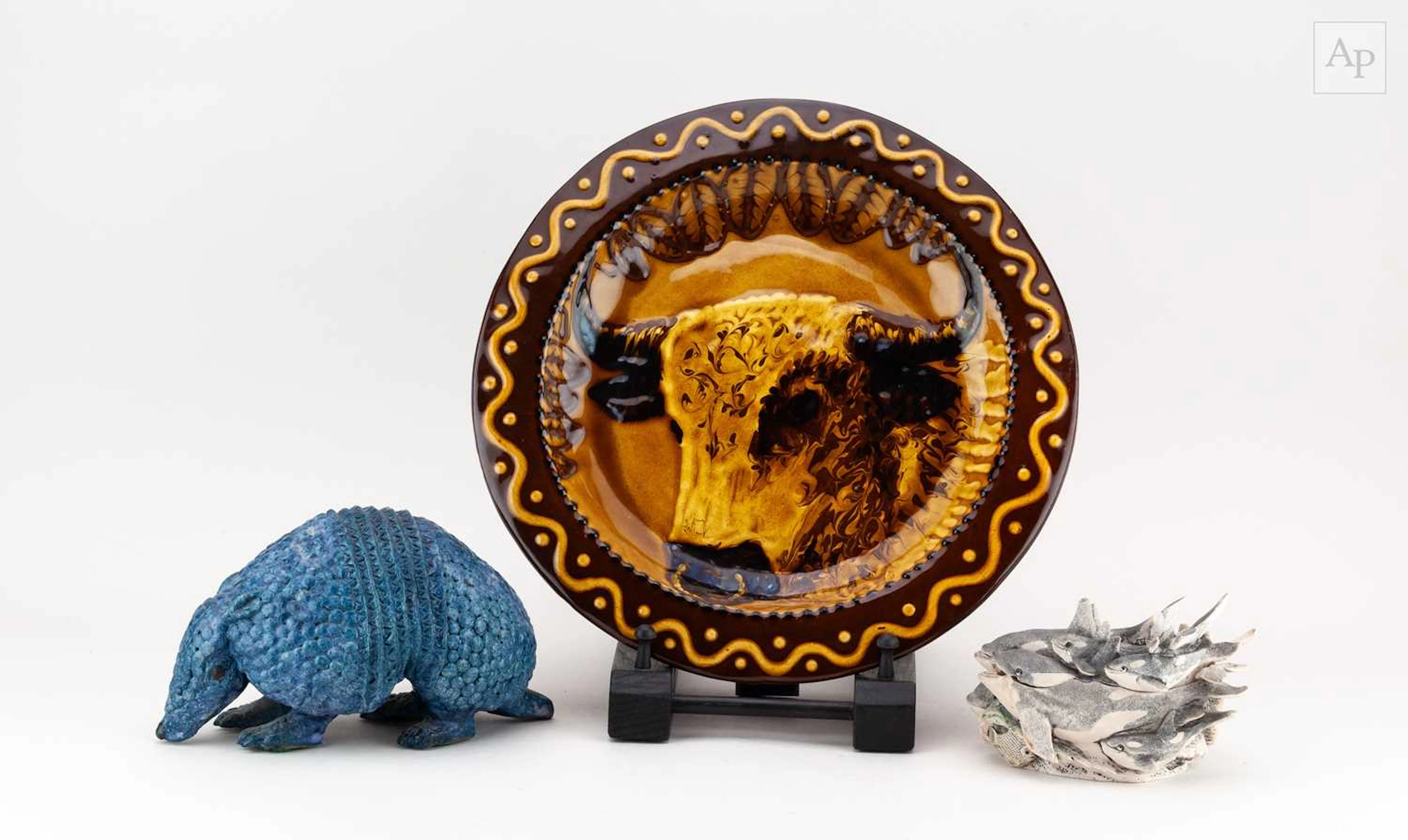 A stoneware sculpture of an armadillo covered in cobalt glaze