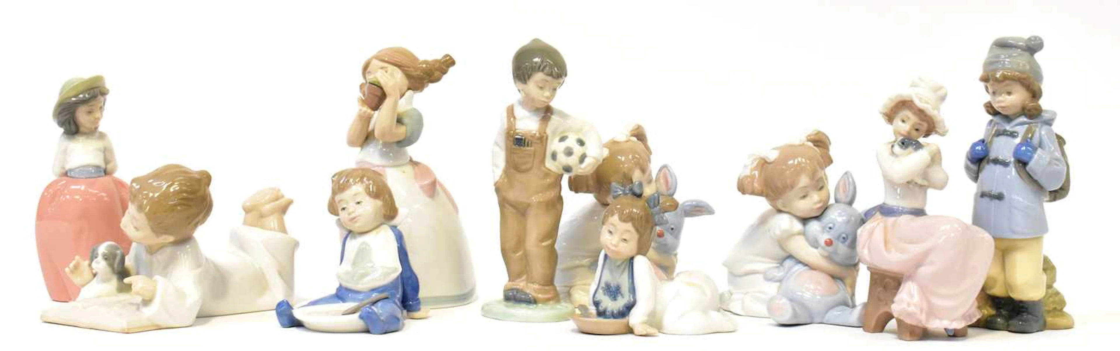NAO; ten porcelain figures of children