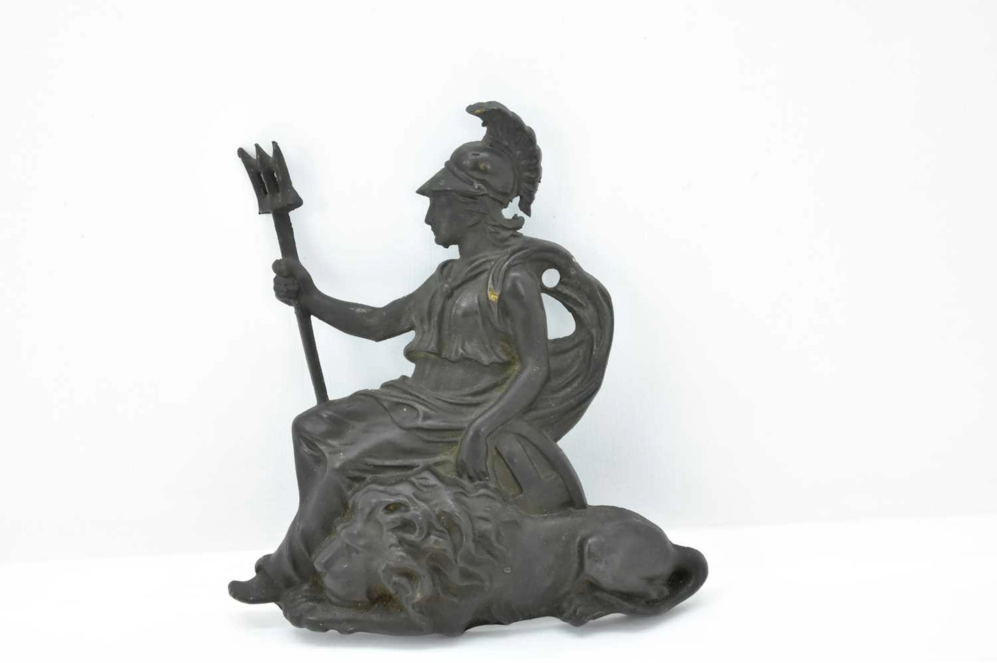 A 19th century patinated cast brass plaque depicting...