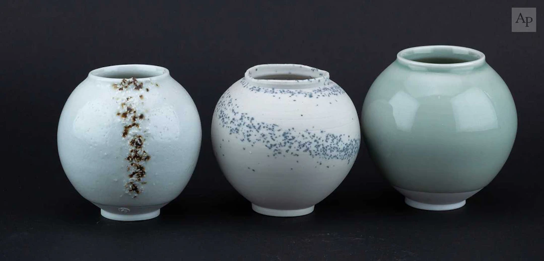 ADAM BUICK (born 1978); a trio of mini porcelain moon...