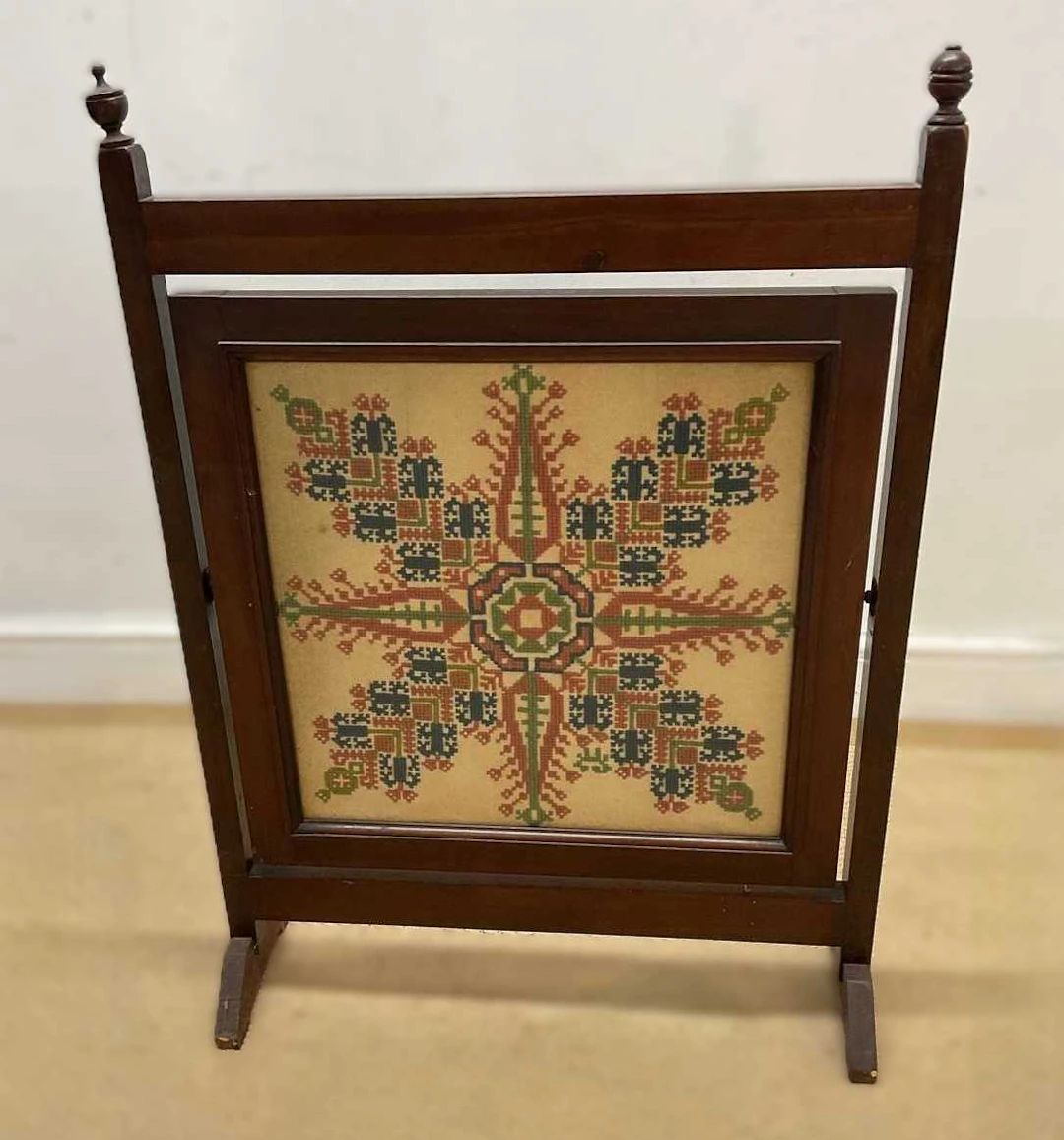 A mahogany framed tapestry fire screen