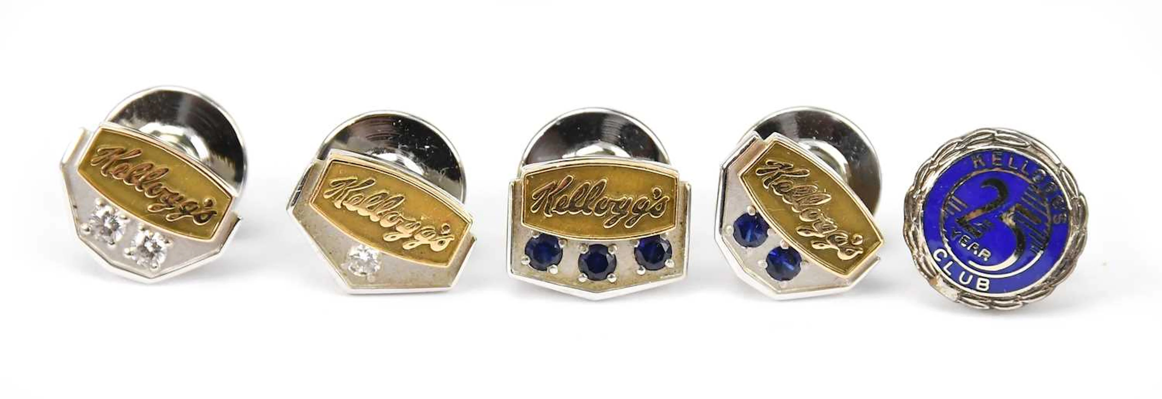 KELLOGG'S; a group of four yellow and white metal service pins