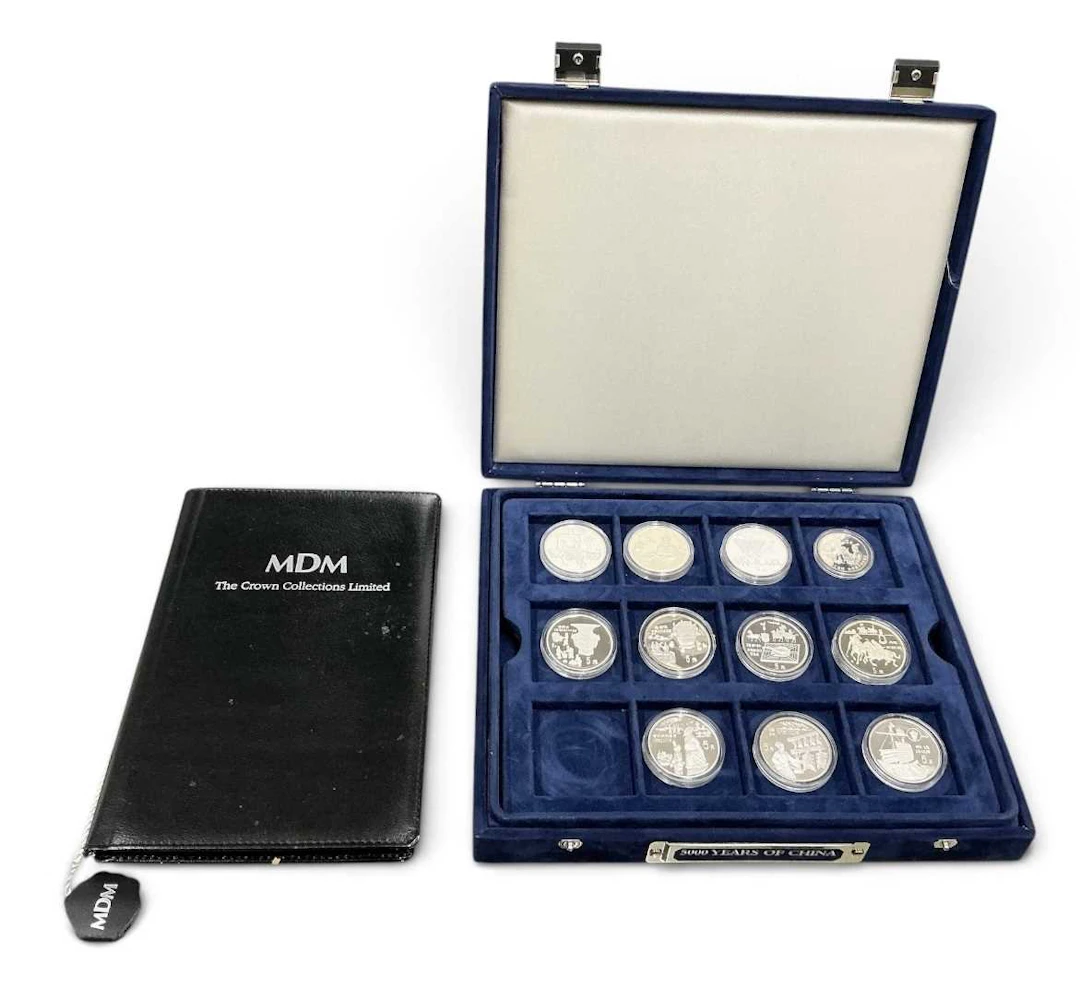 MDM THE CROWN COLLECTIONS LTD; twenty-three silver coins...