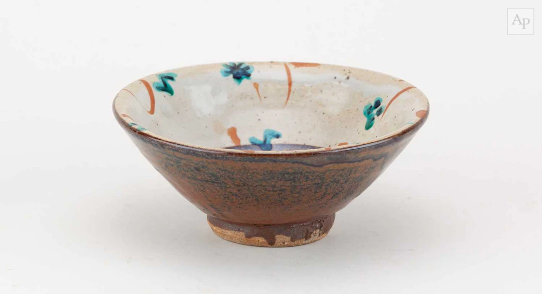 JOHN MALTBY (1936-2020); a small stoneware bowl decorated with stylised flowers