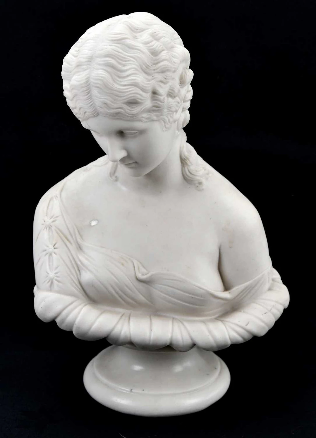 A 19th century Parian ware bust of a maiden wearing a flowing robe