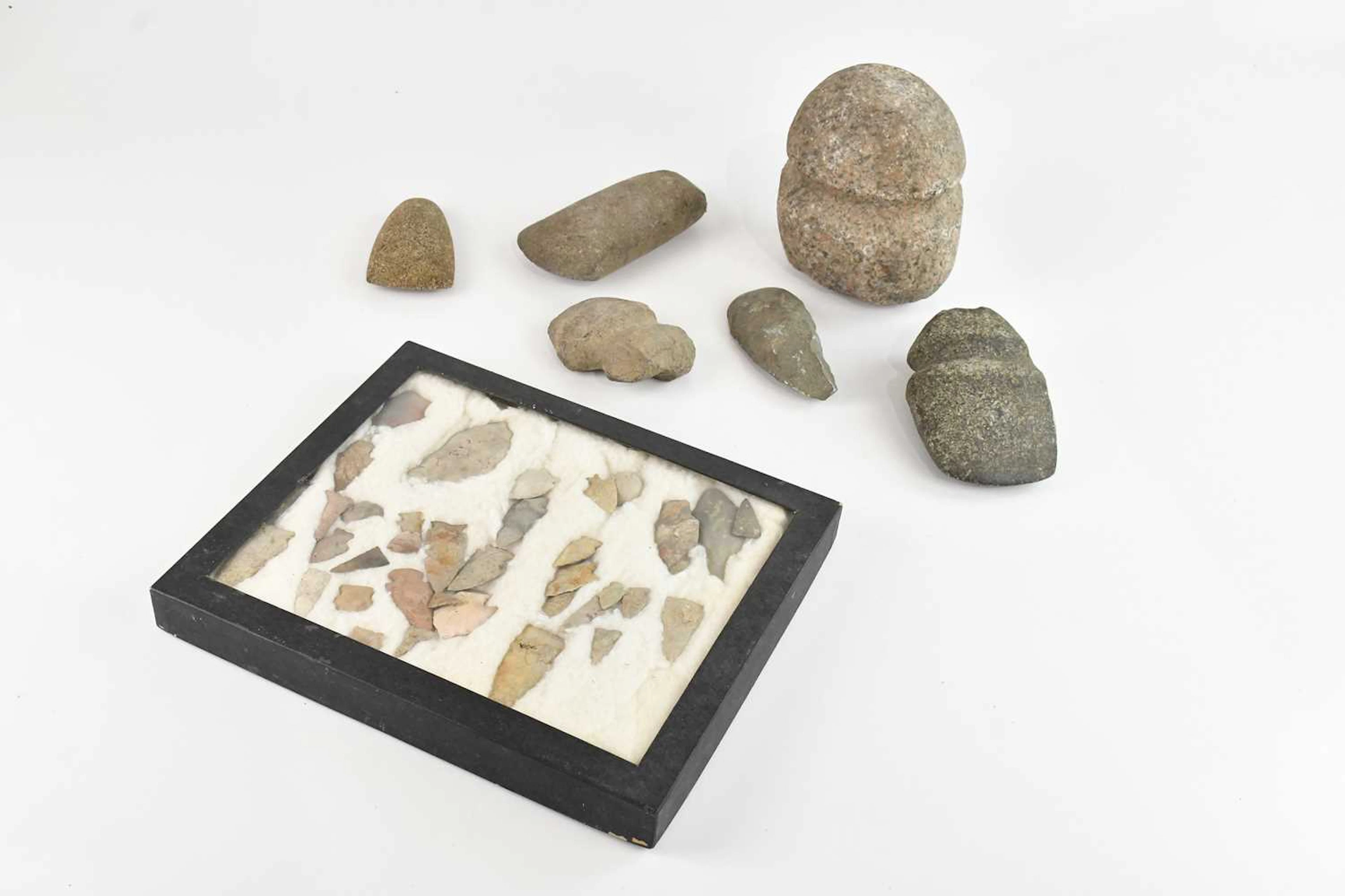 A collection of Native American artefacts including arrowheads