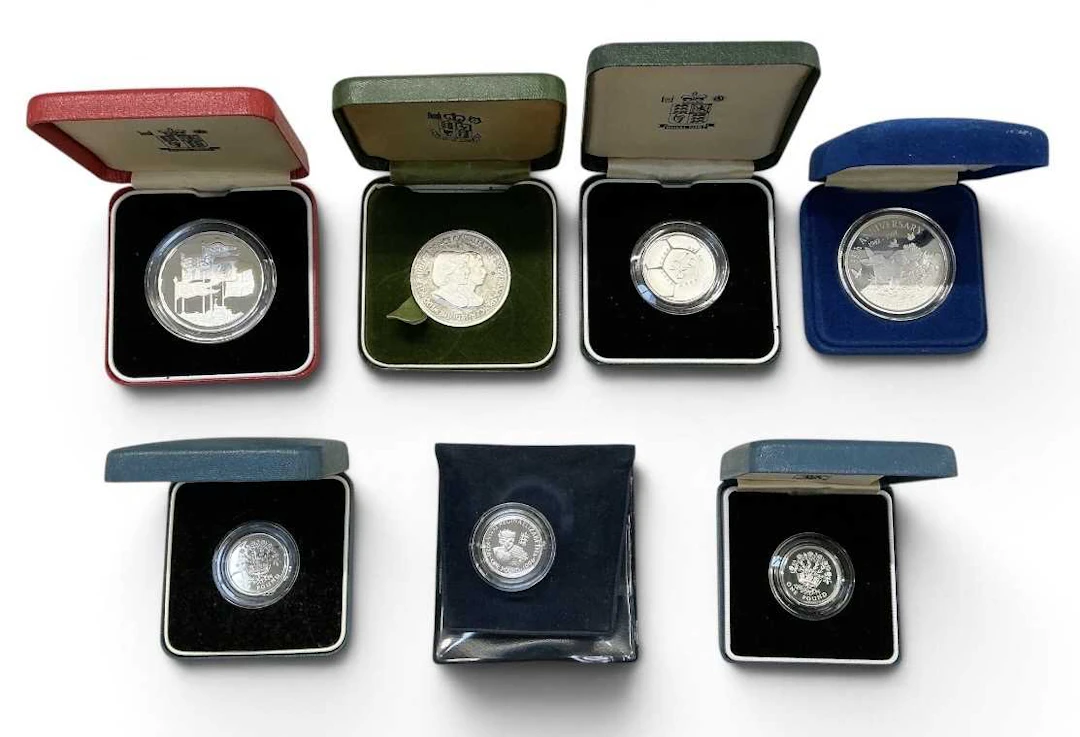 Seven boxed silver and silver proof coins