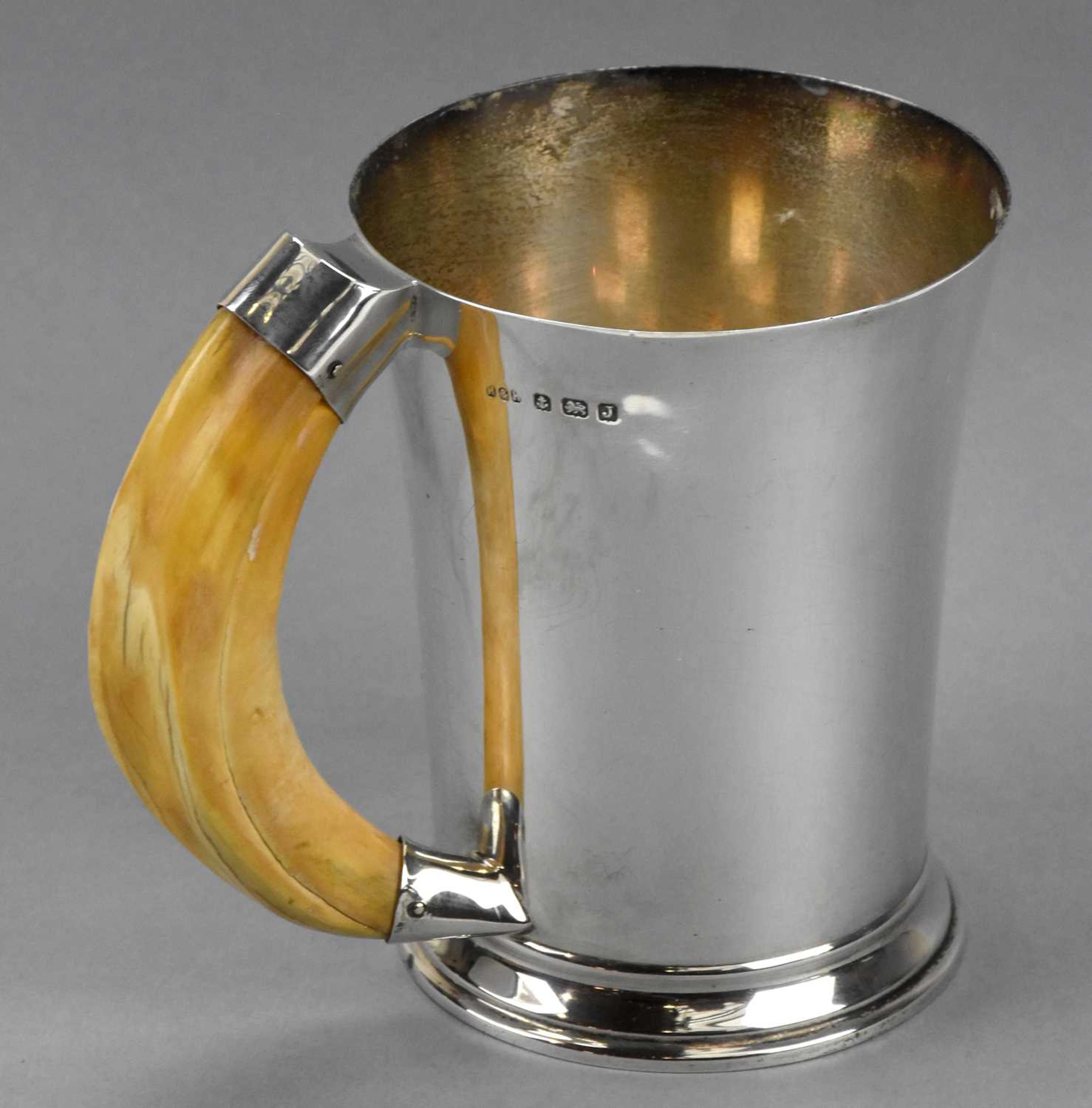 HUKIN & HEATH; a George V hallmarked silver Art Deco mug