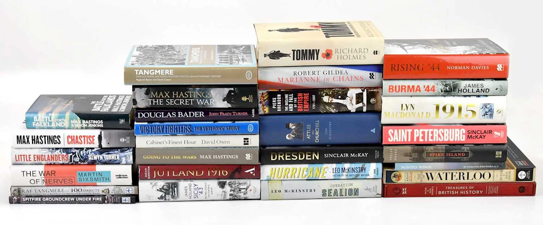A collection of military history books signed by the authors