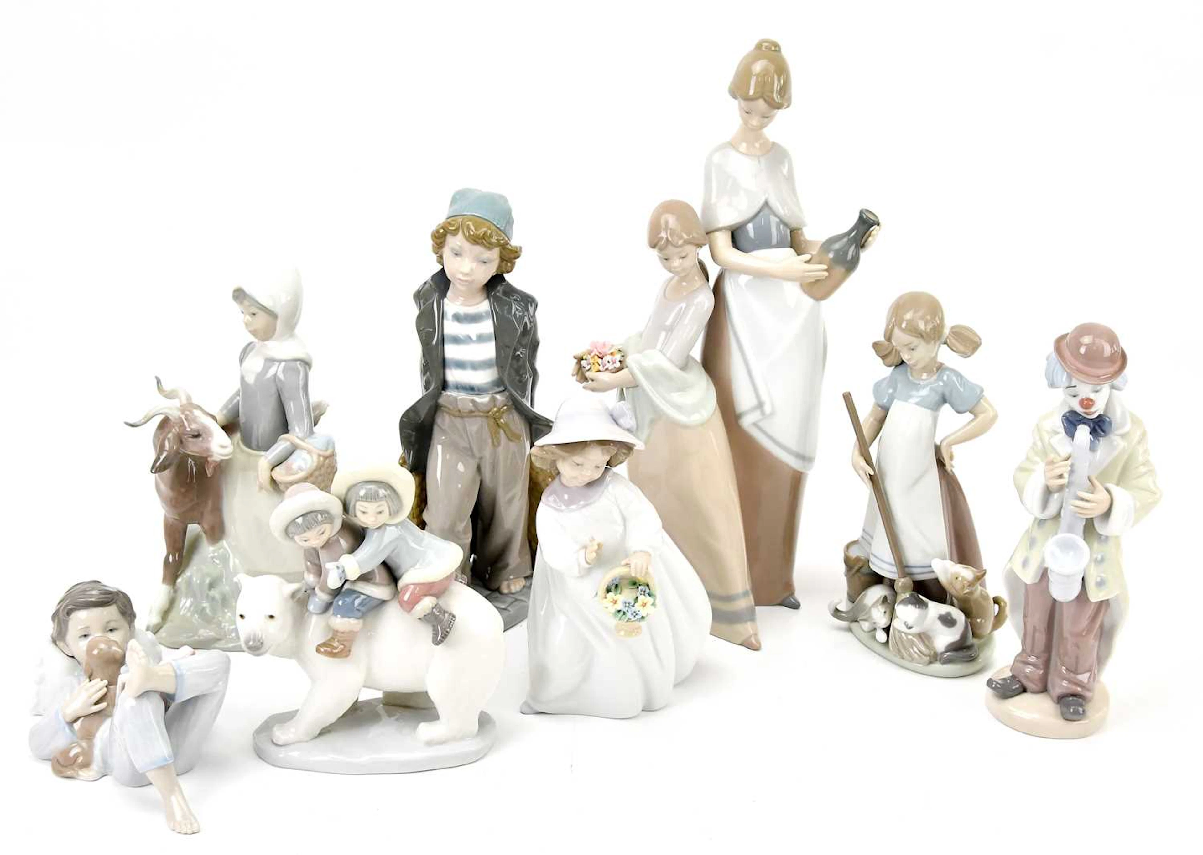 LLADRÓ; eight ceramic figures including a large figure...
