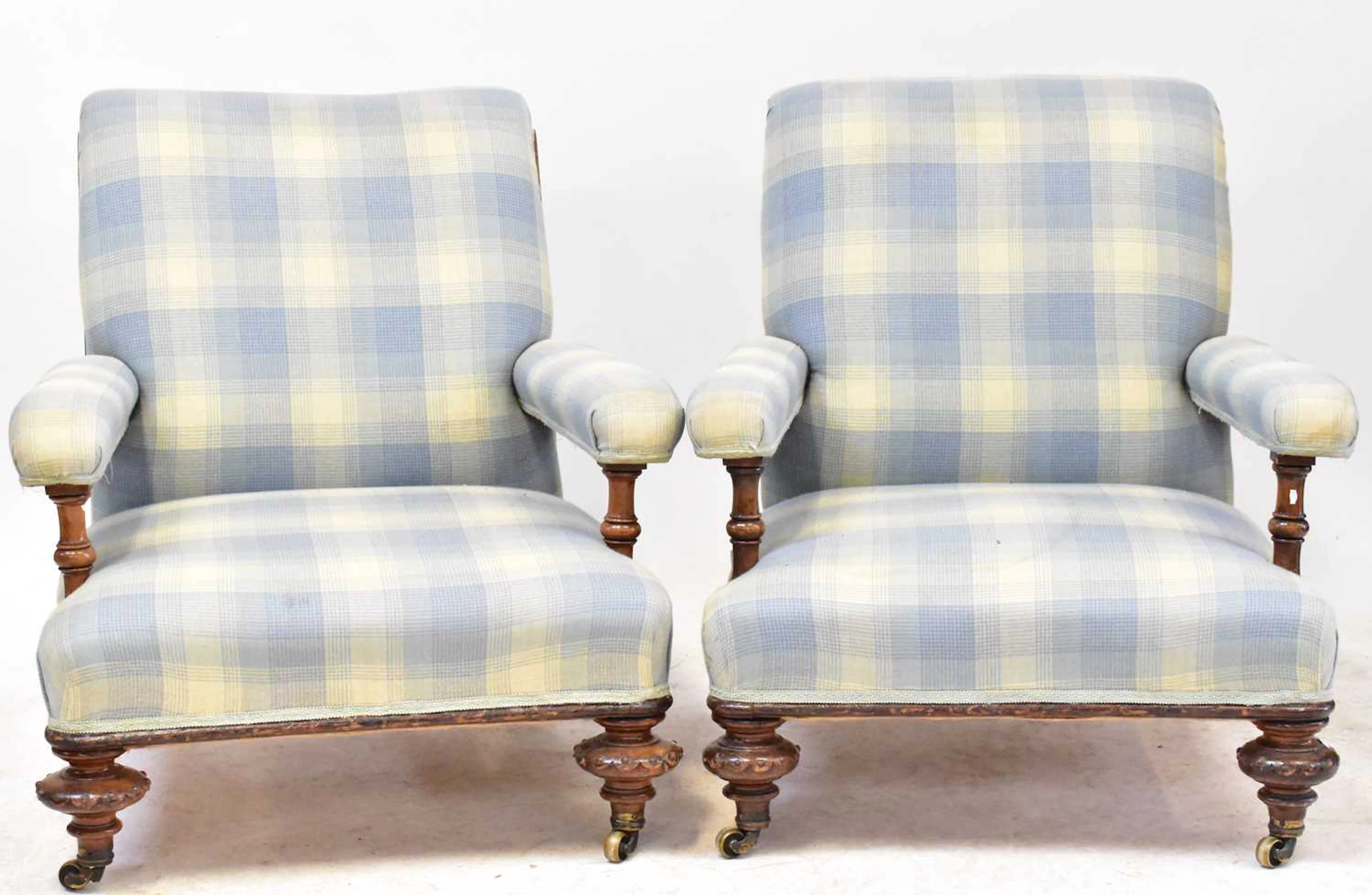 A pair of Victorian carved oak library chairs