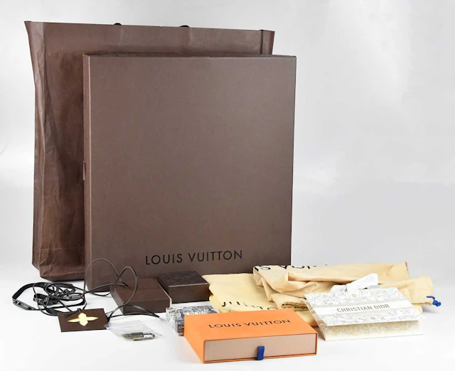 LOUIS VUITTON; a collection of Louis Vuitton and other dust bags and boxes
