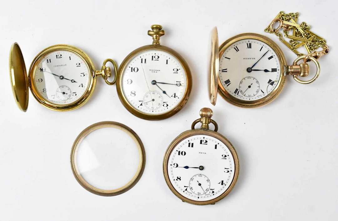 Four gold-plated pocket watches
