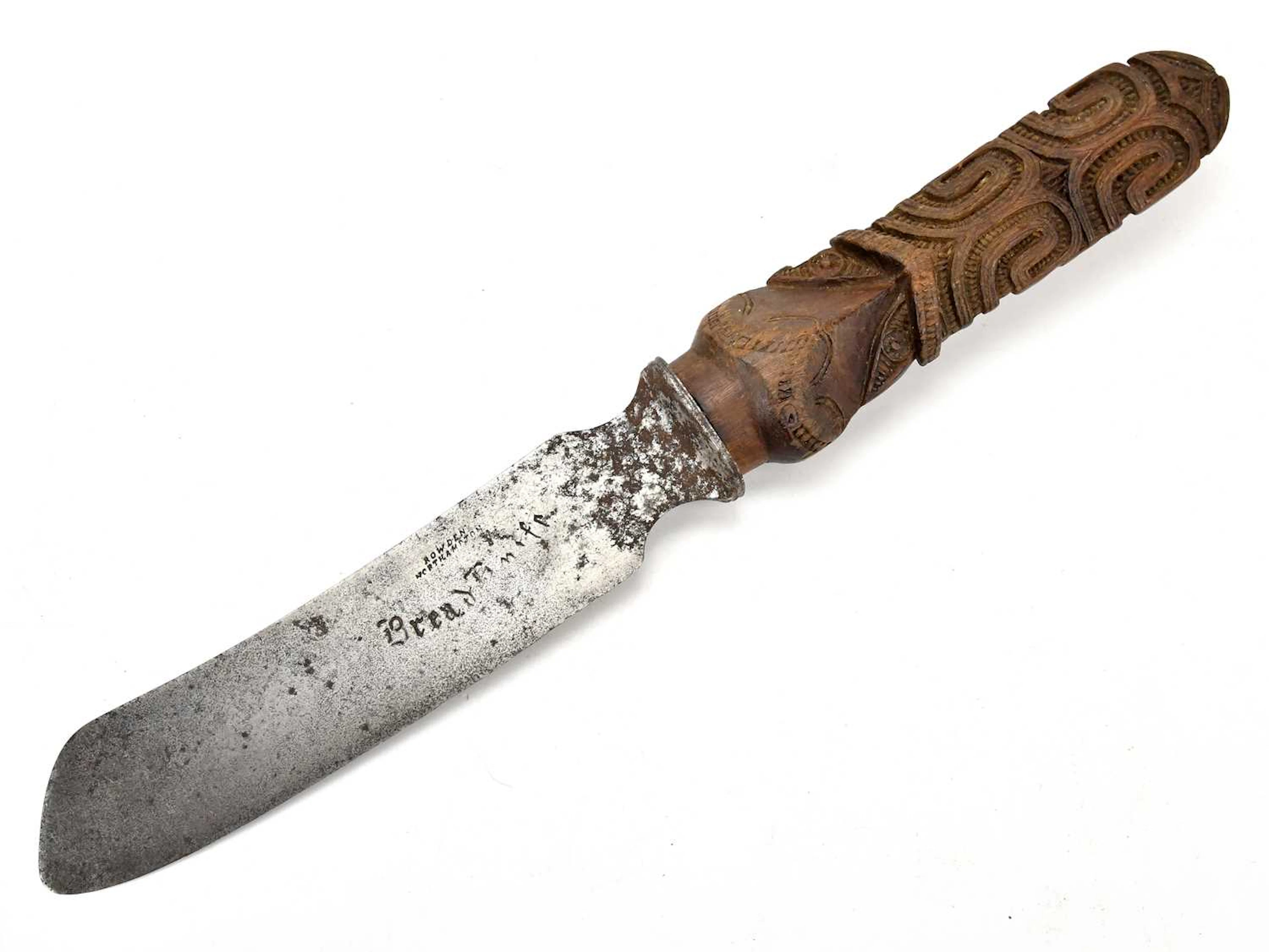 A carved Maori ceremonial spear tip (Taiaha) mounted as a handle to a knife