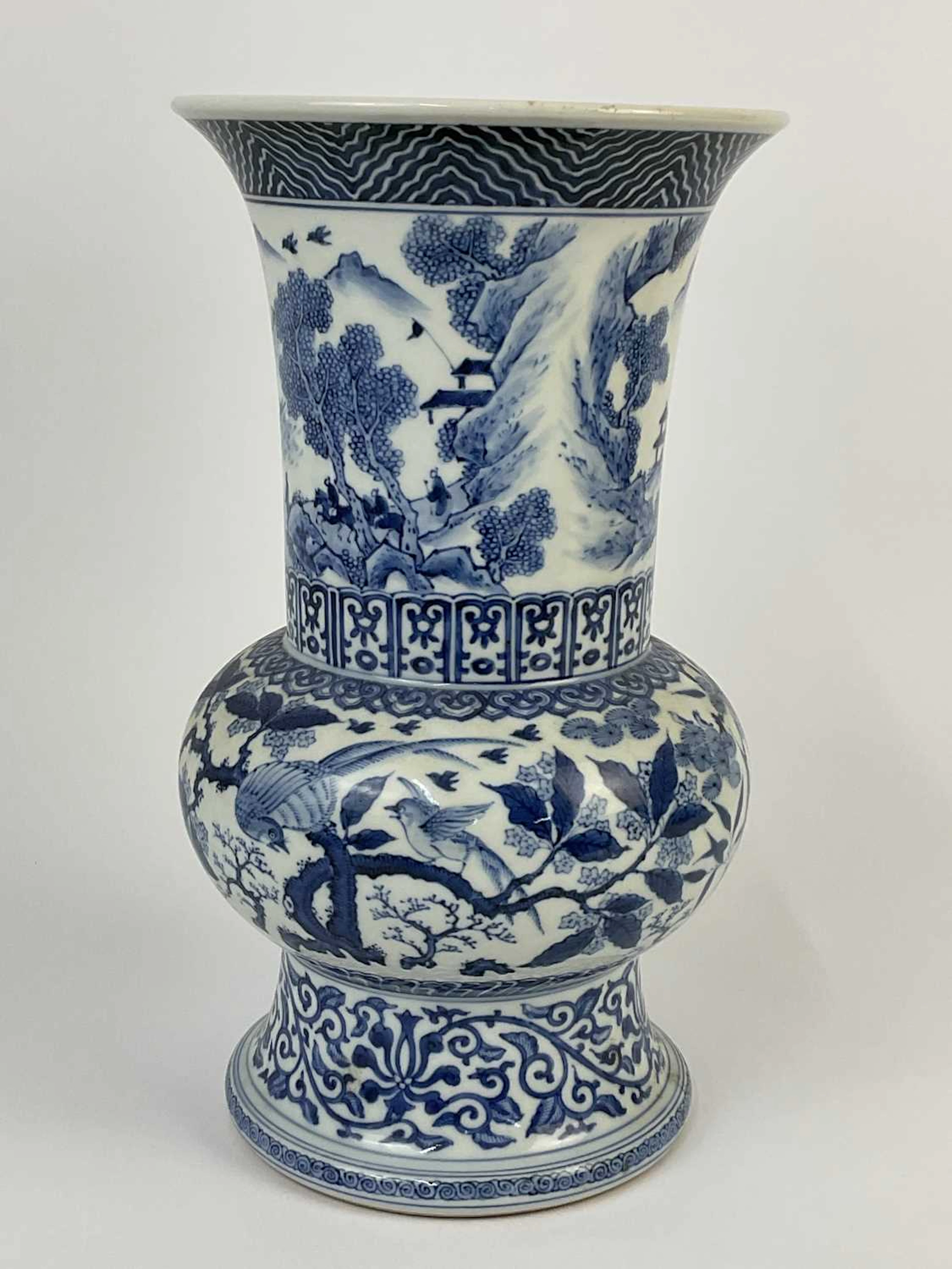 A Chinese blue and white porcelain flare neck vase...