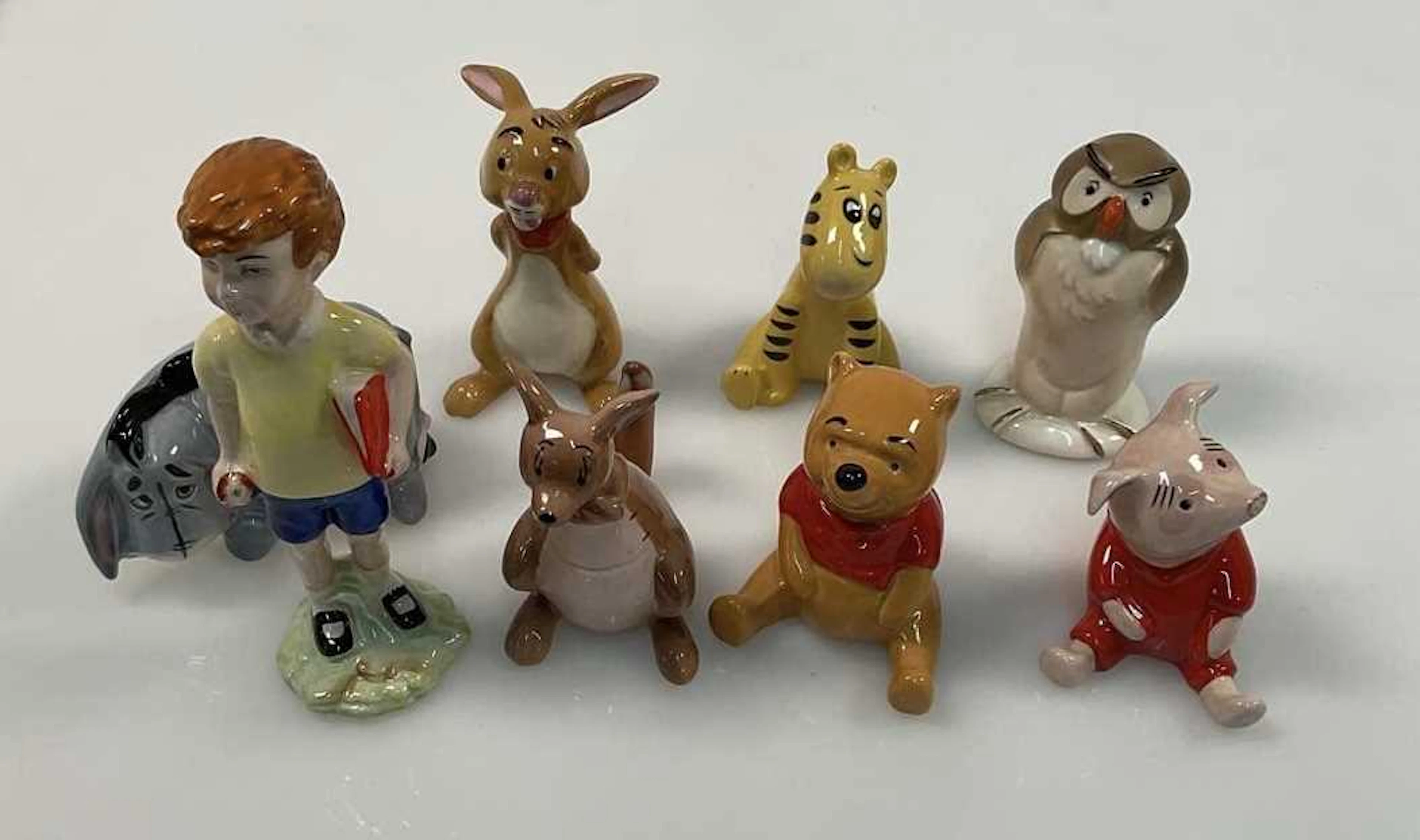 BESWICK; eight Walt Disney character figures including Christopher Robin