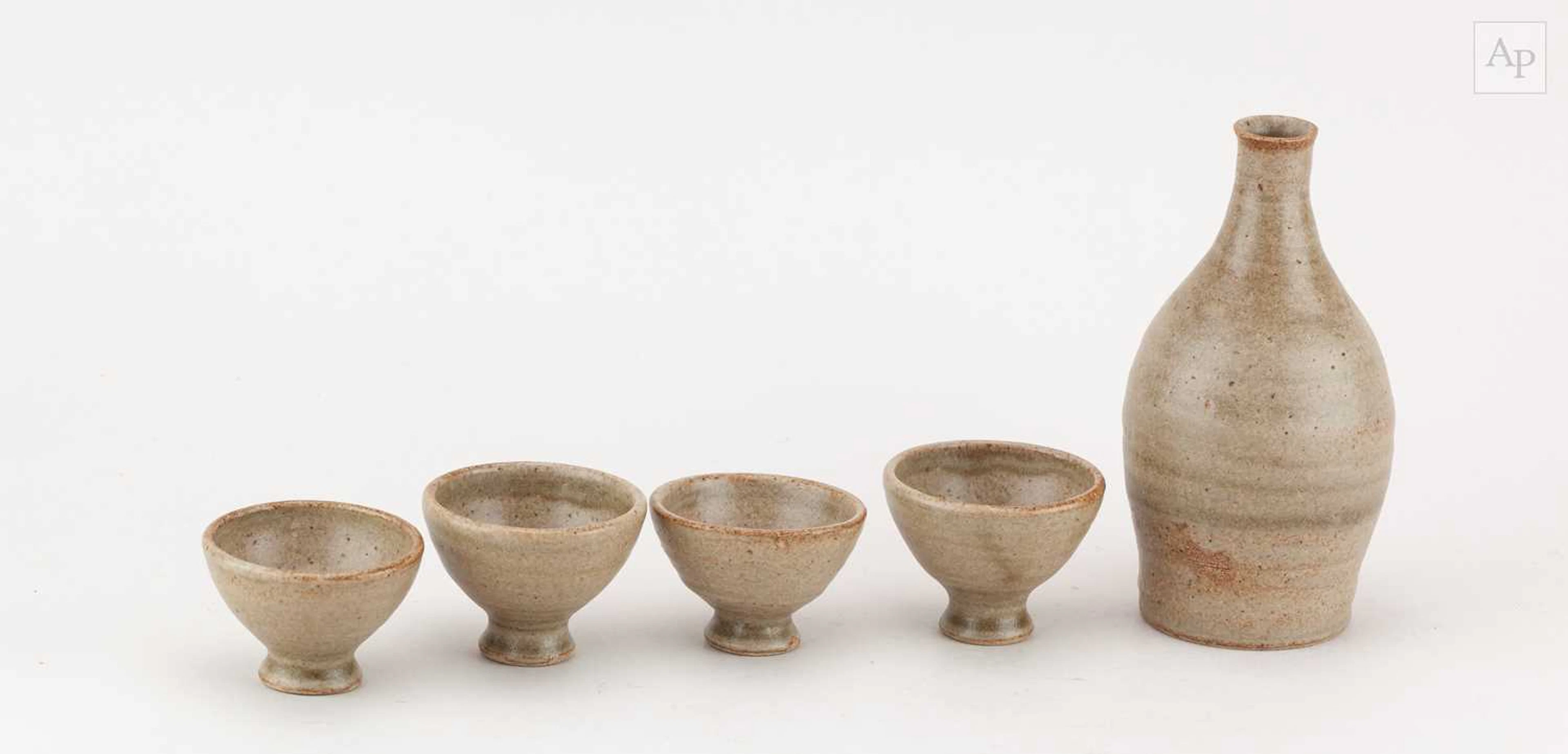 DAN ARBEID (1928-2010); a stoneware sake bottle and four...
