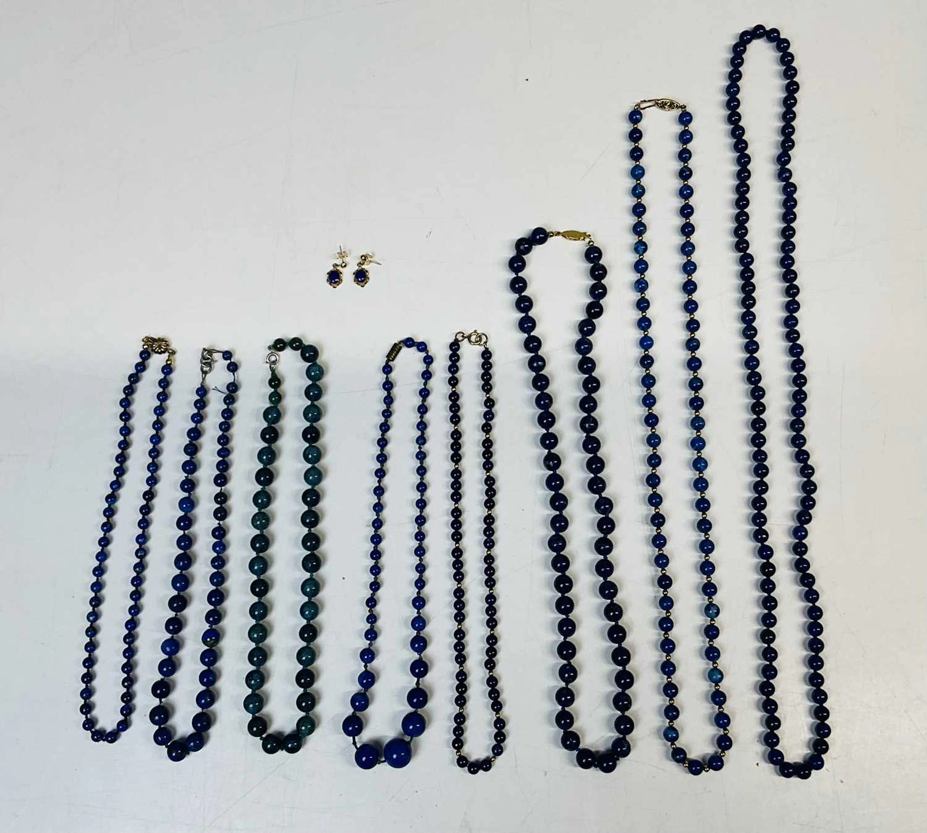 Seven lapis lazuli and sodalite bead necklaces and a pair...