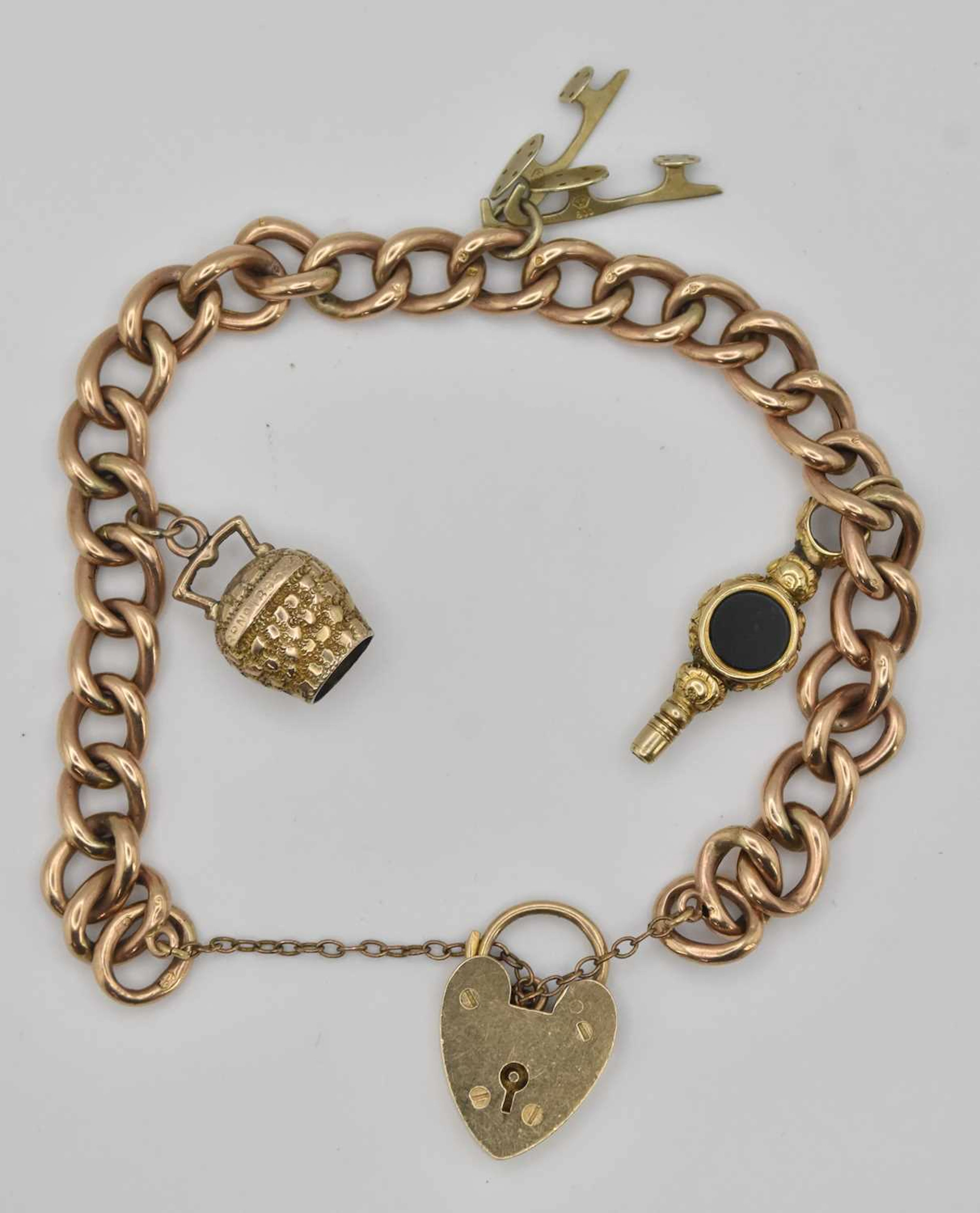A 9ct yellow gold charm bracelet